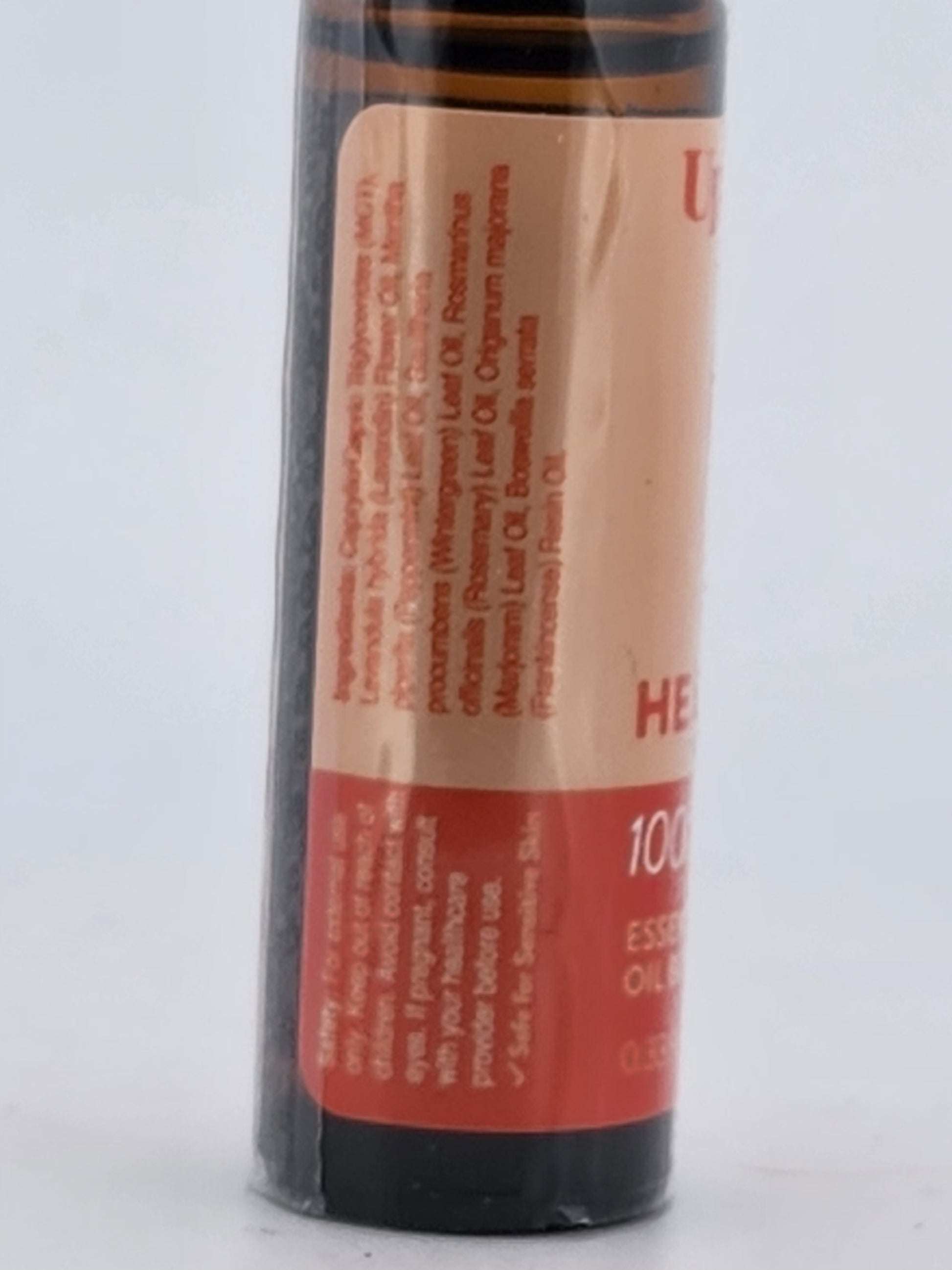 Essential oil bottle with a red label on a white background