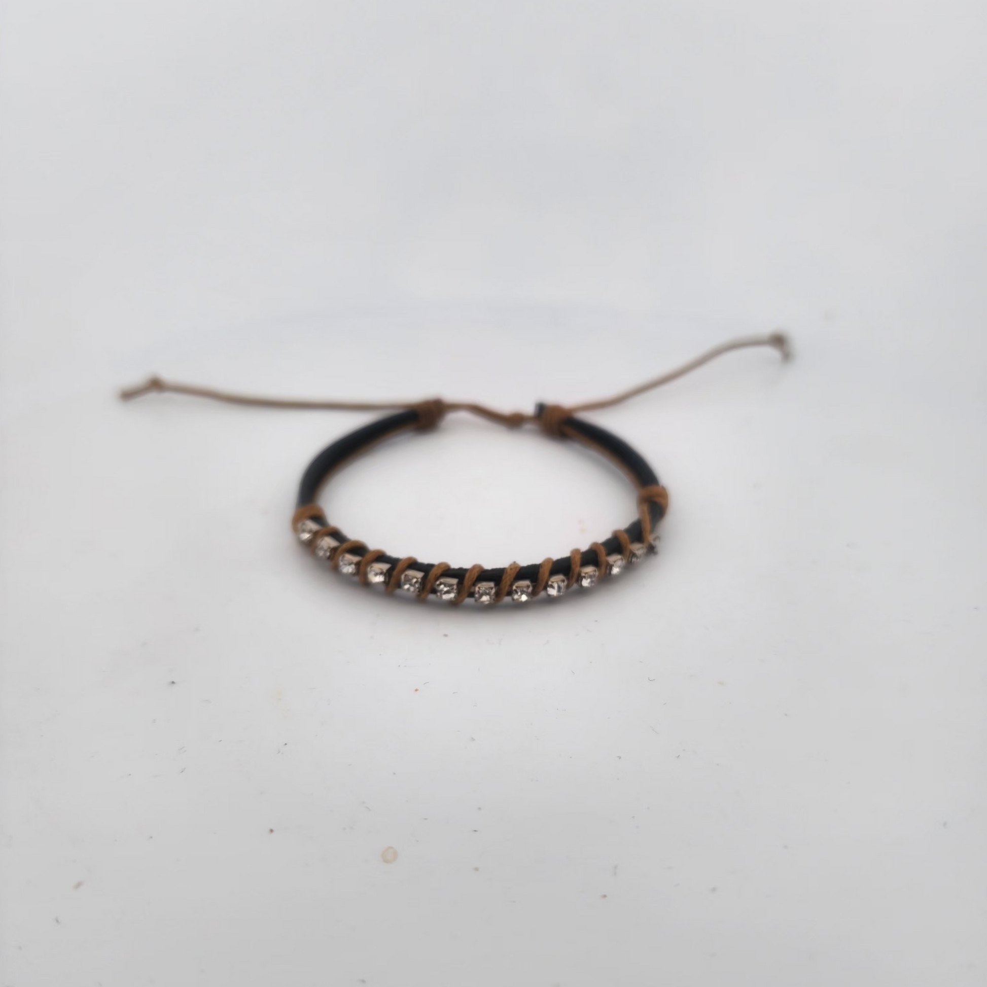 Bracelet with brown beads on a white background