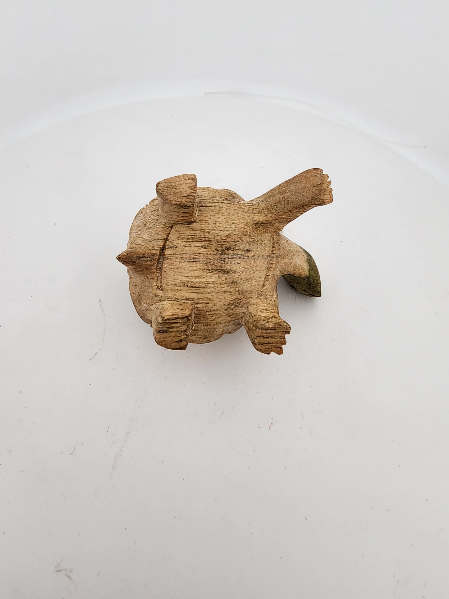 Wooden fish-shaped object on a white background