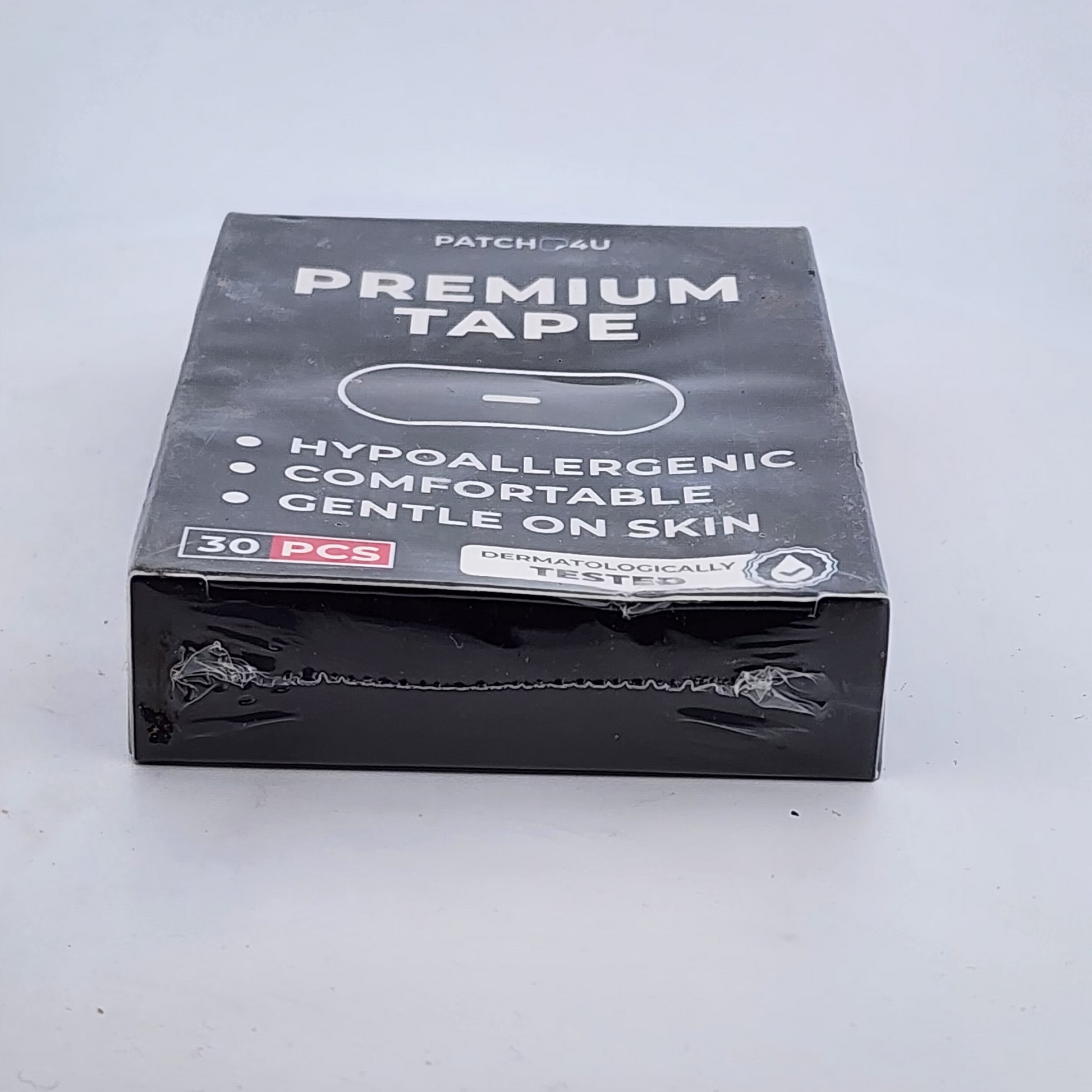 Box of Patch AU Premium Tape on a white background