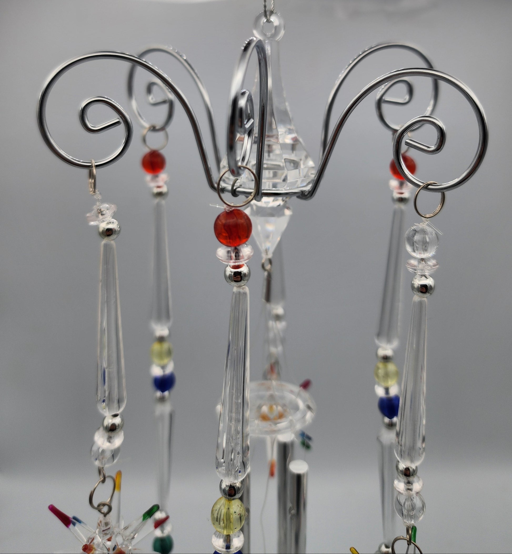 Decorative hanging earrings on a stand with a blurred background