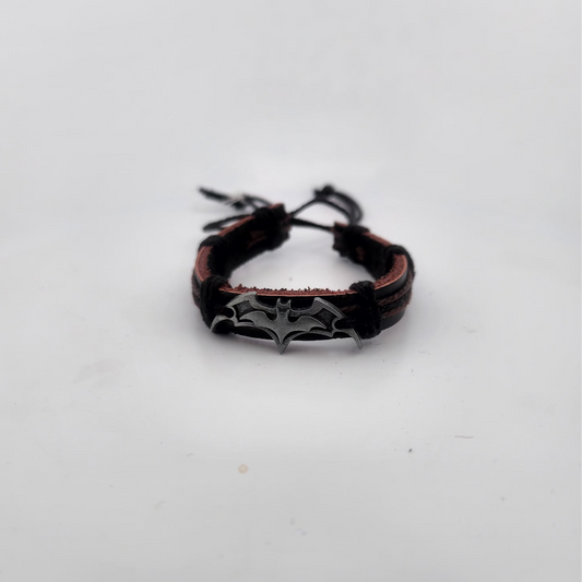 Bracelet with spider web design on a white background