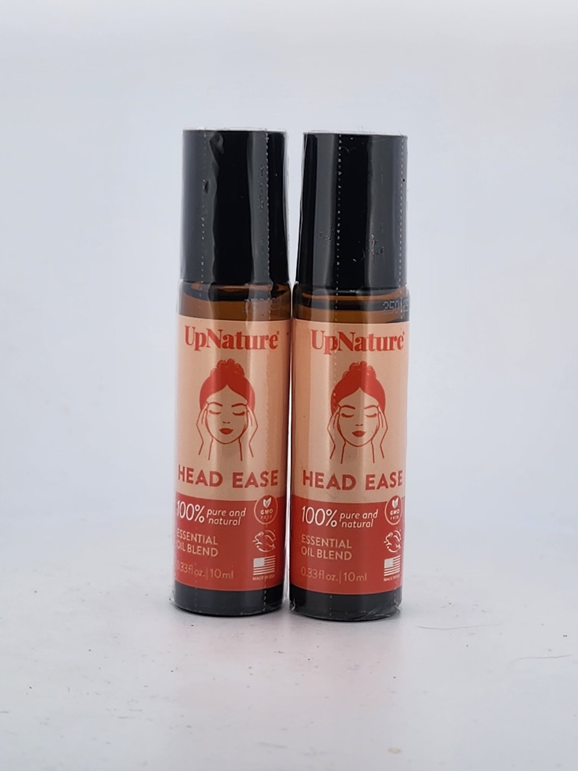 Two bottles of UpNature Head Ease on a white background