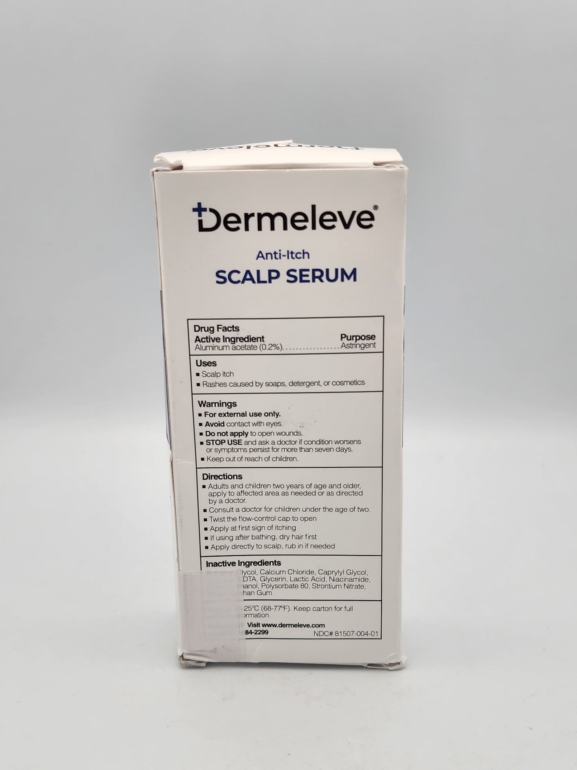 Dermeleve Anti-Itch Scalp Serum packaging on a gray background