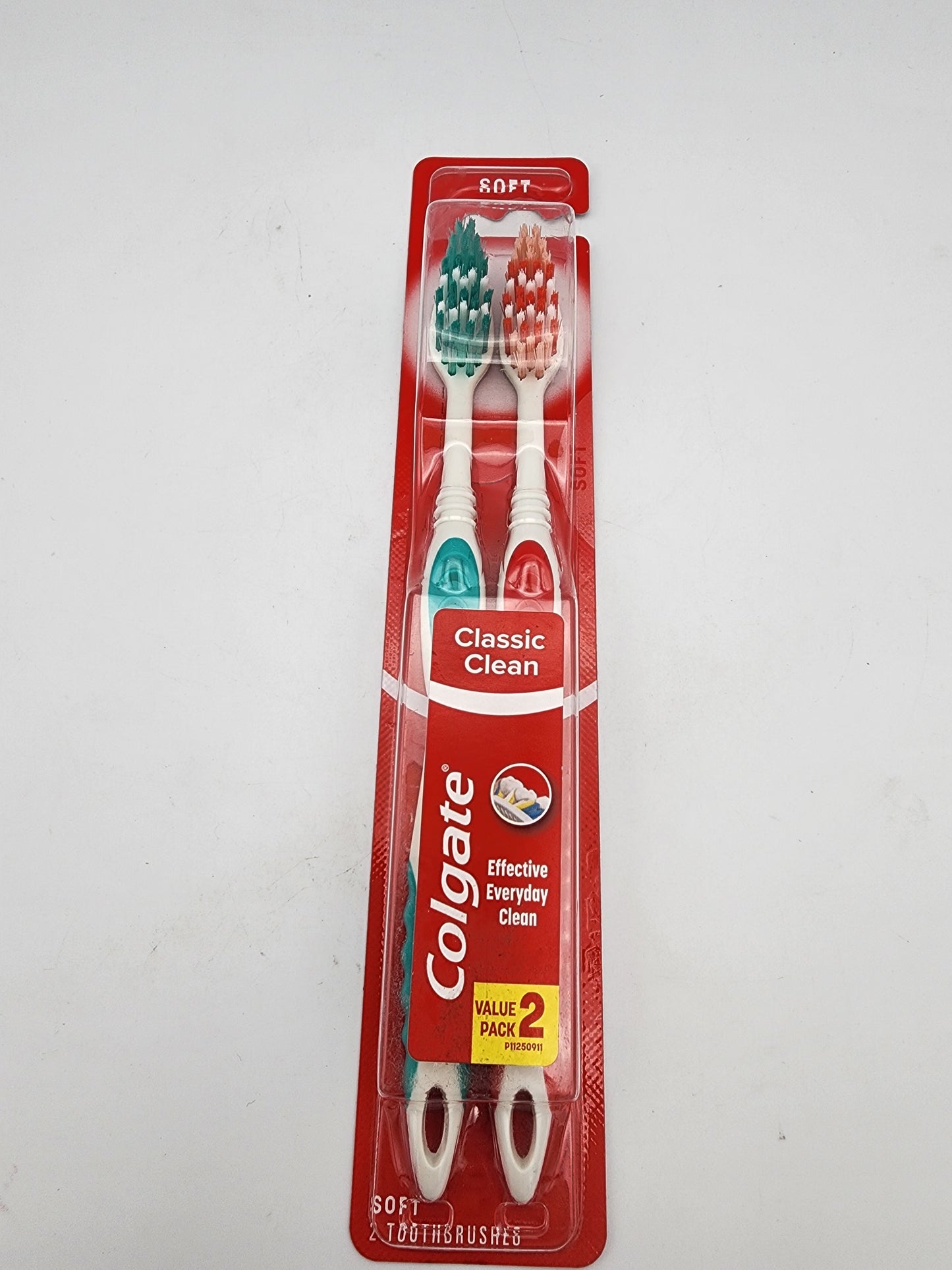 Colgate toothbrushes in packaging on a white background