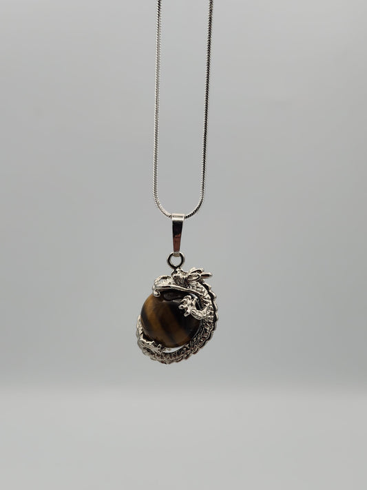 Necklace with a pendant featuring a tiger's eye stone on a gray background
