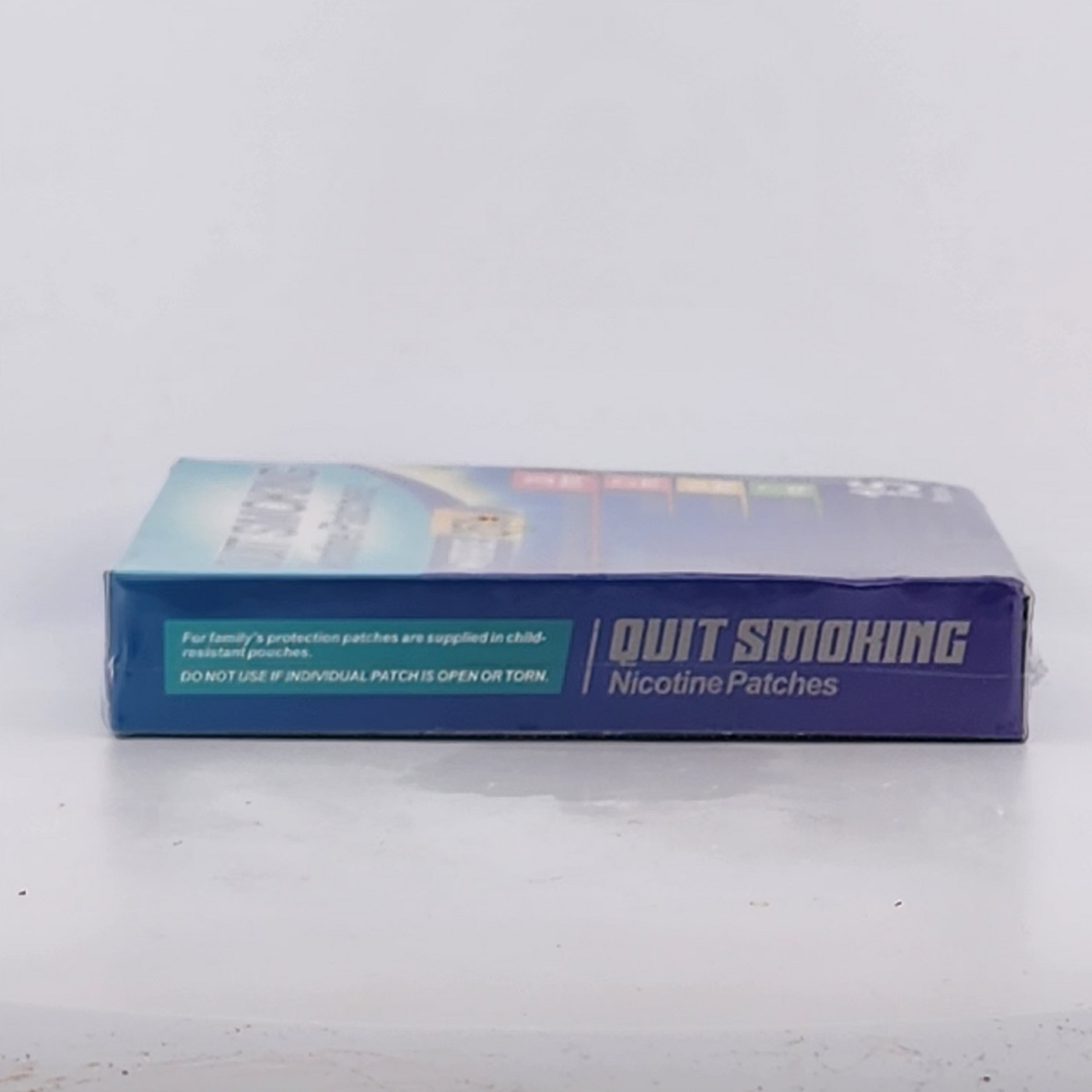 Box of nicotine patches for quitting smoking on a white surface