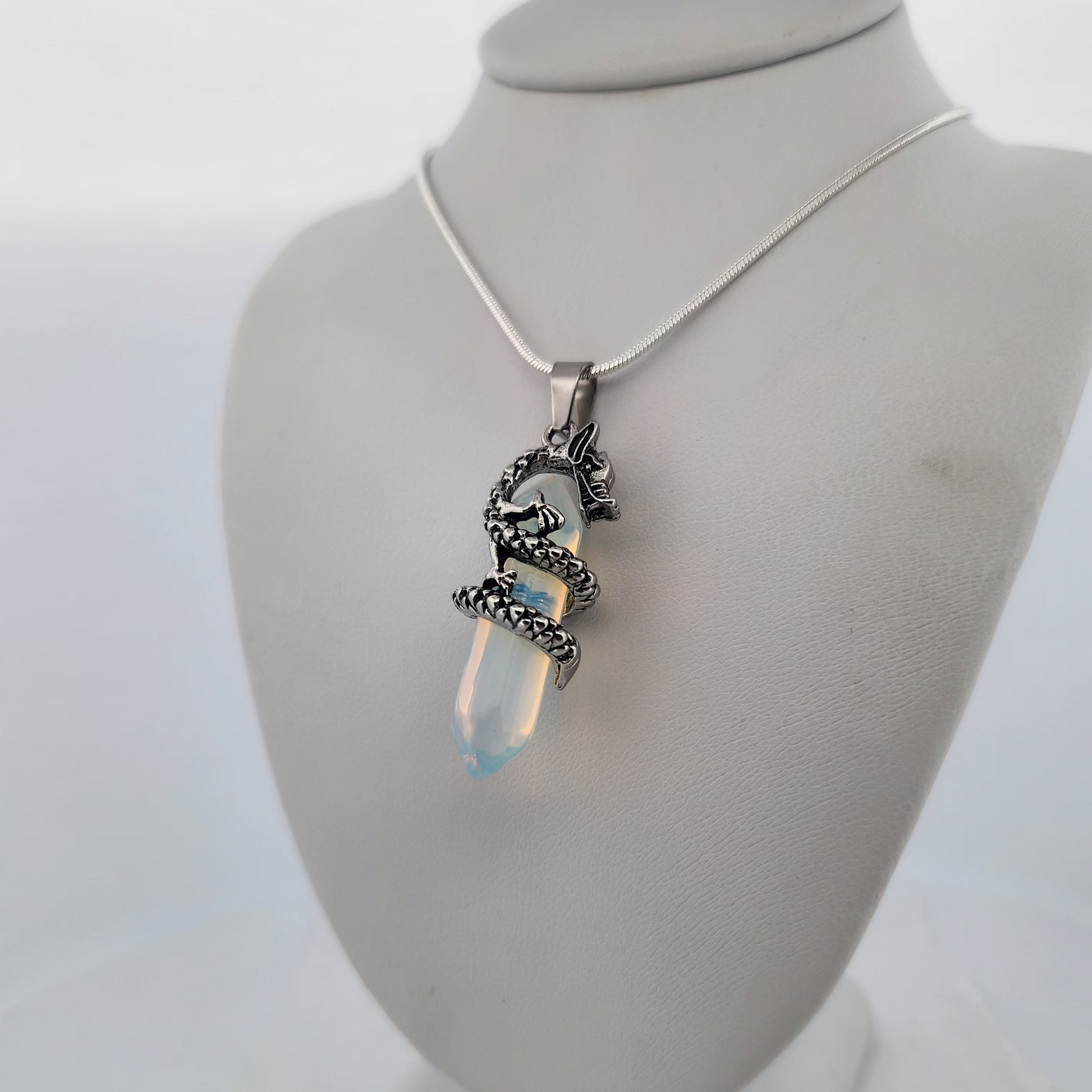 Necklace with a pendant on a mannequin bust against a white background