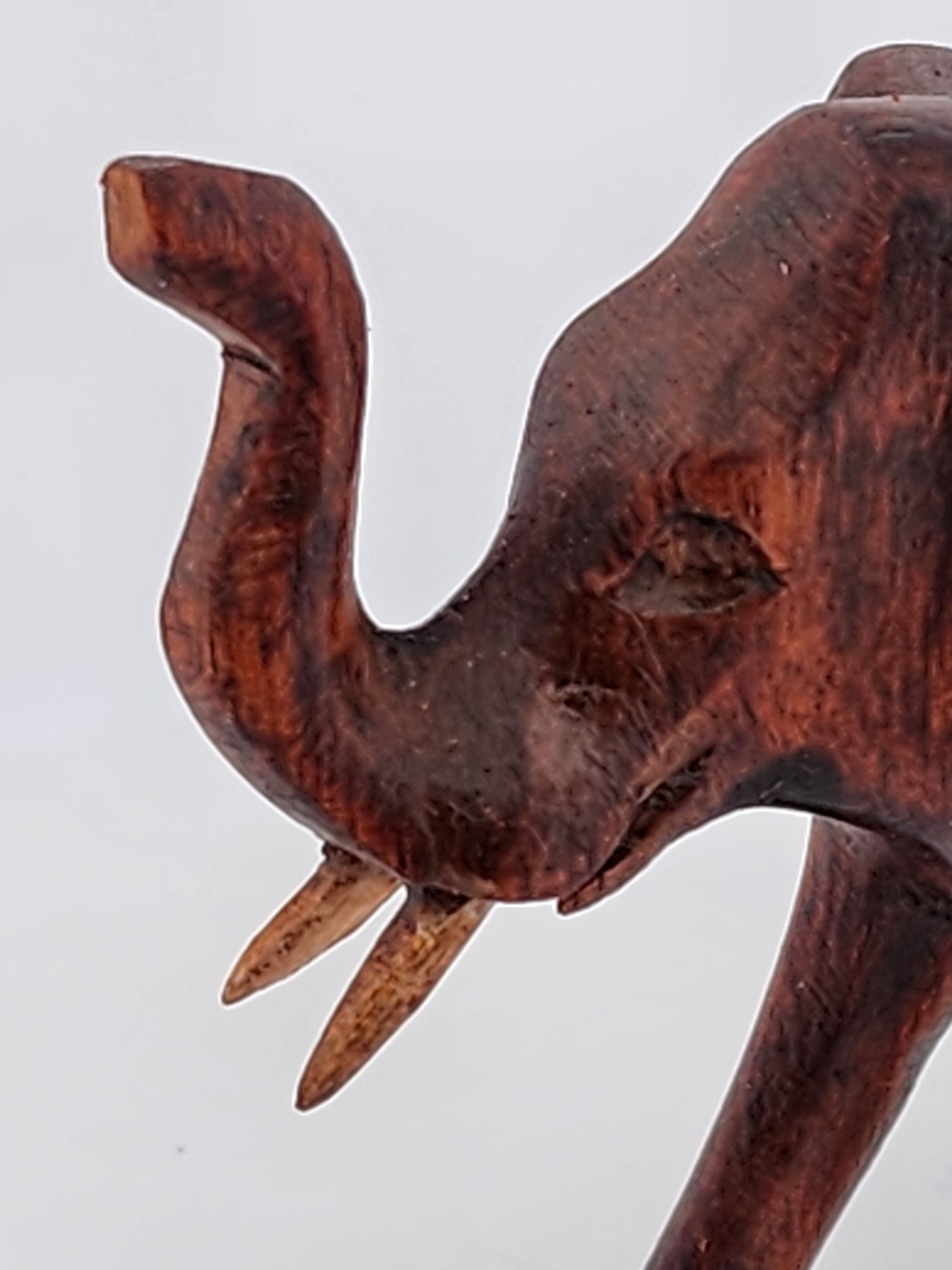 Wooden elephant figurine on a white background