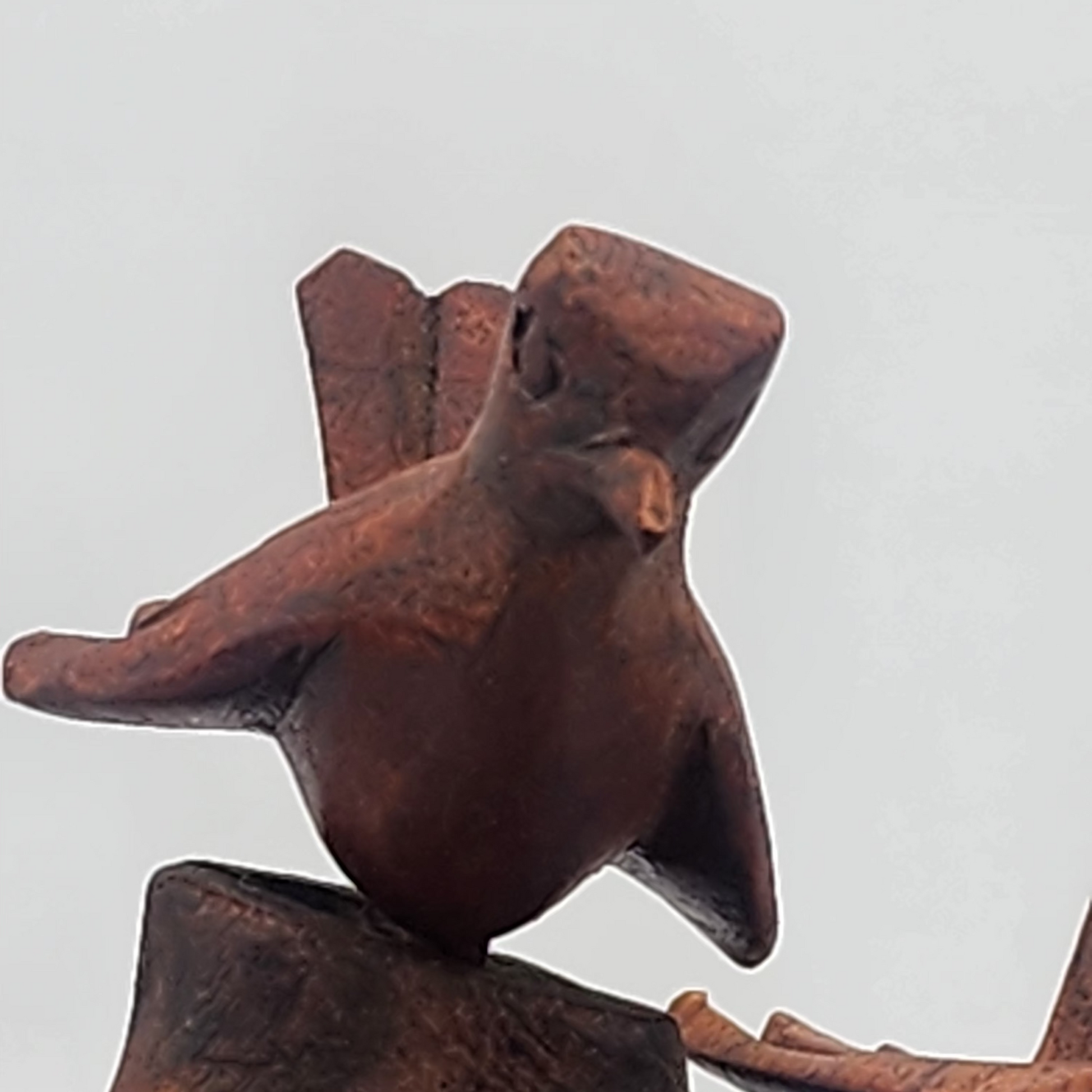 Abstract wood sculpture on a light gray background