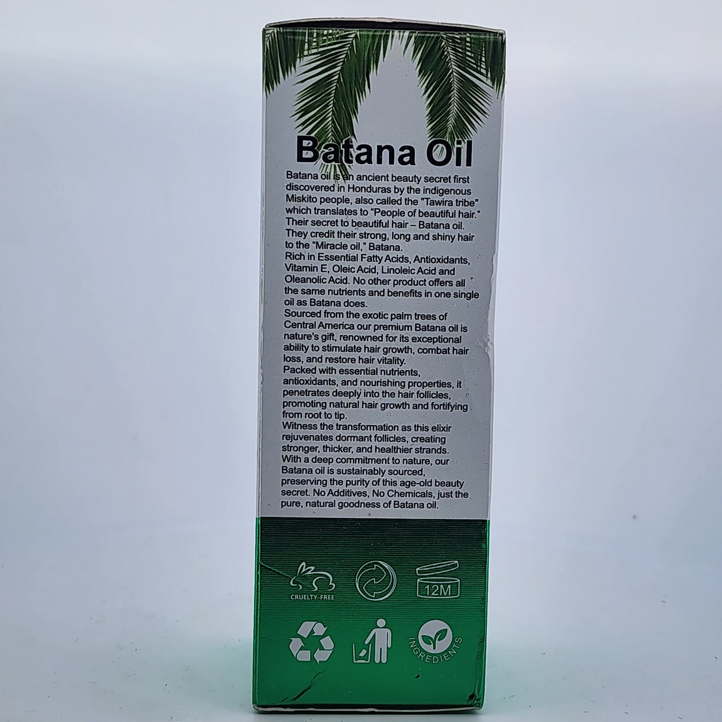 Box of Batana Oil with palm tree design on a white background