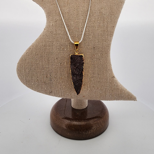 Necklace with a dark brown pendant on a mannequin bust against a white background