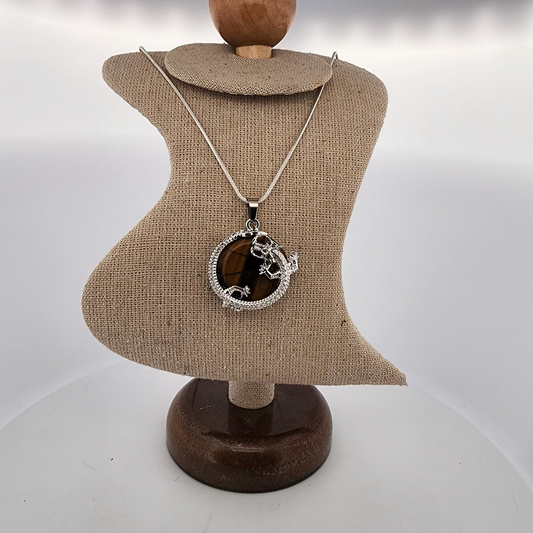 Necklace with a pendant on a mannequin bust against a white background
