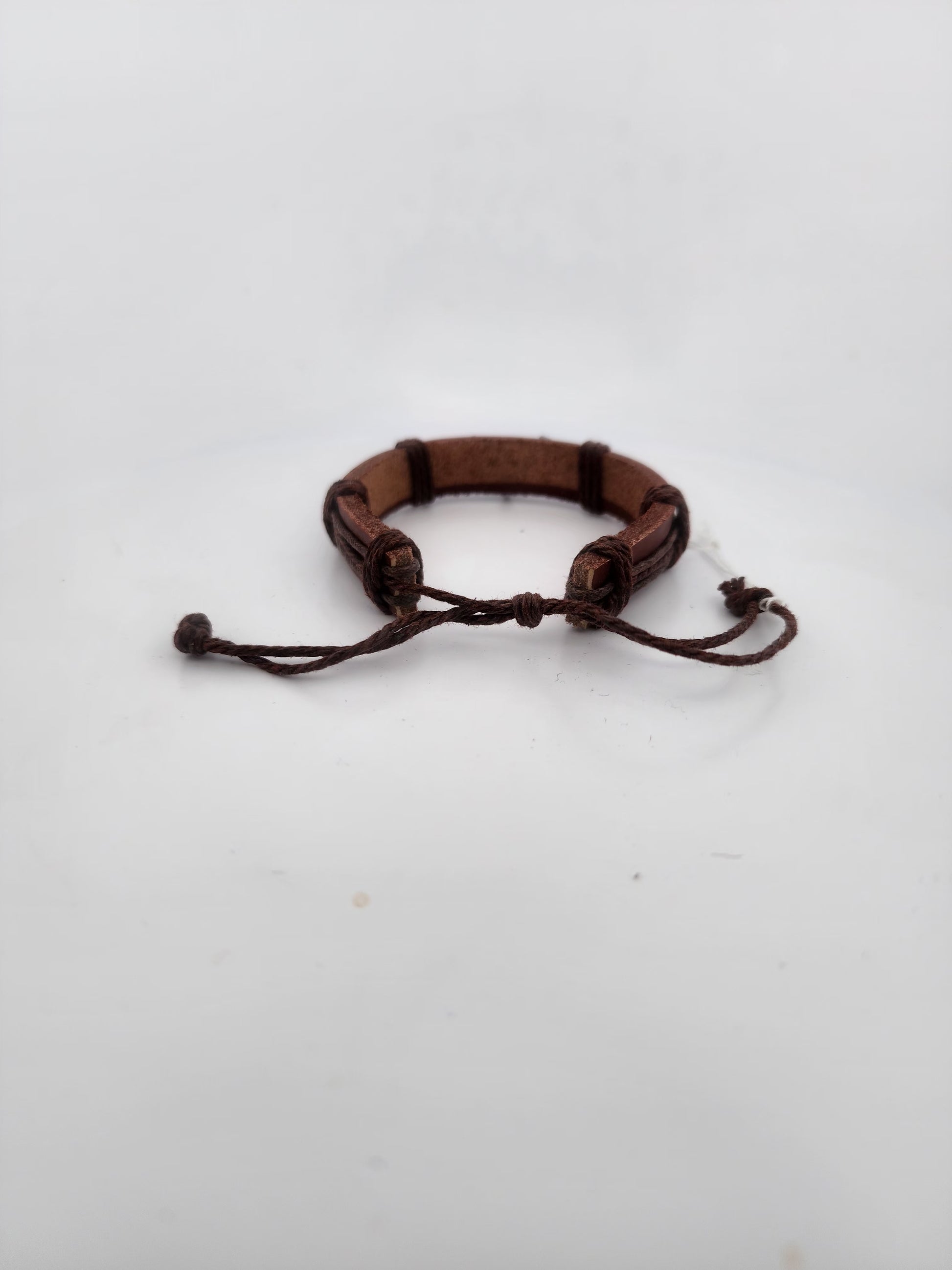 Brown leather bracelet on a white background