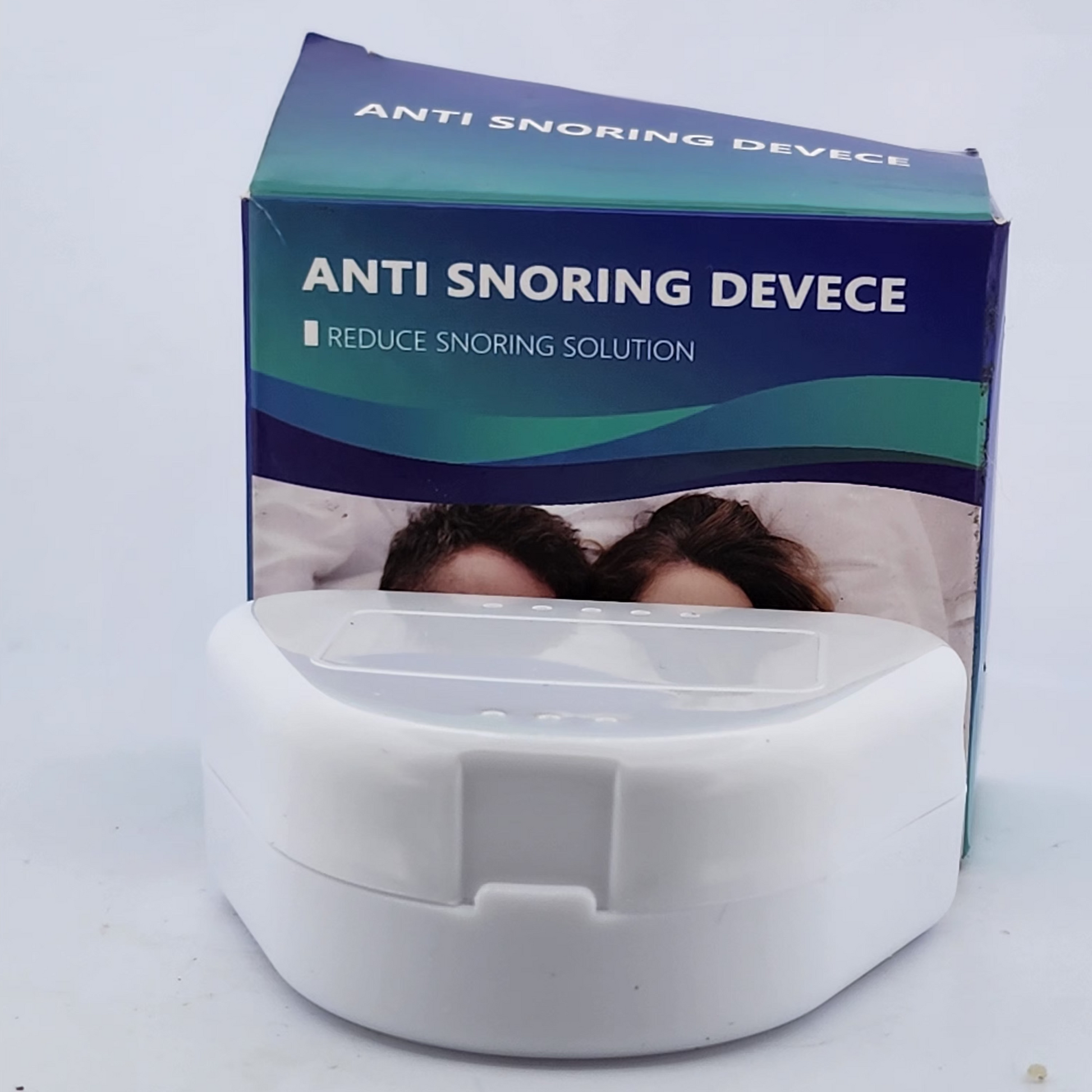 Anti snoring device with packaging on a white background