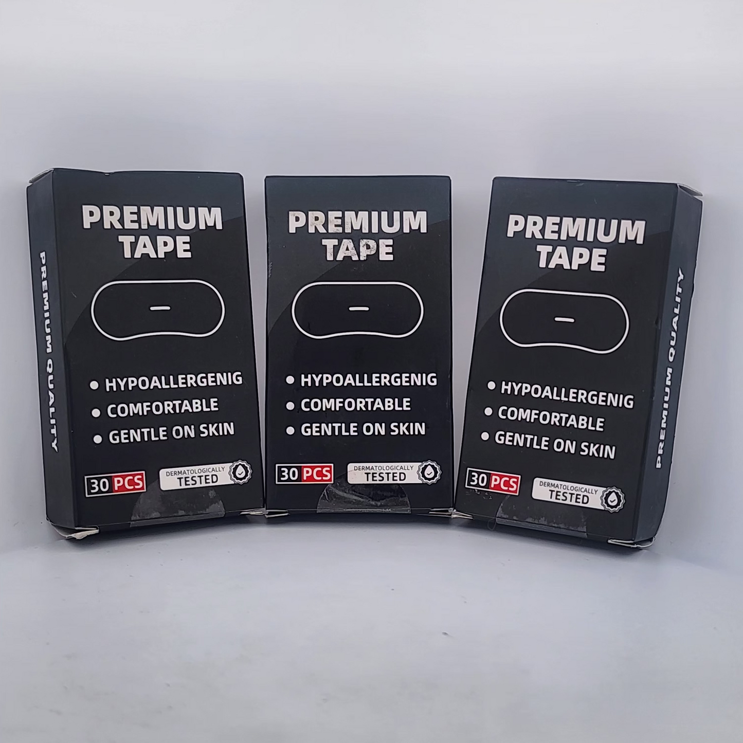 Three packages of premium tape on a white background