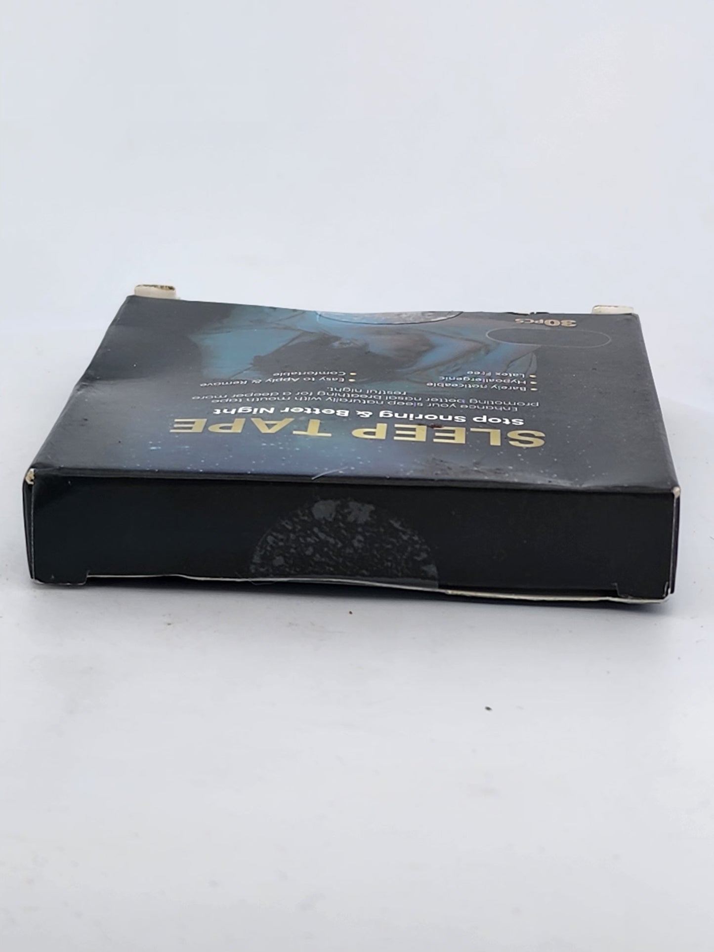 Black sleep tape packaging on a white background