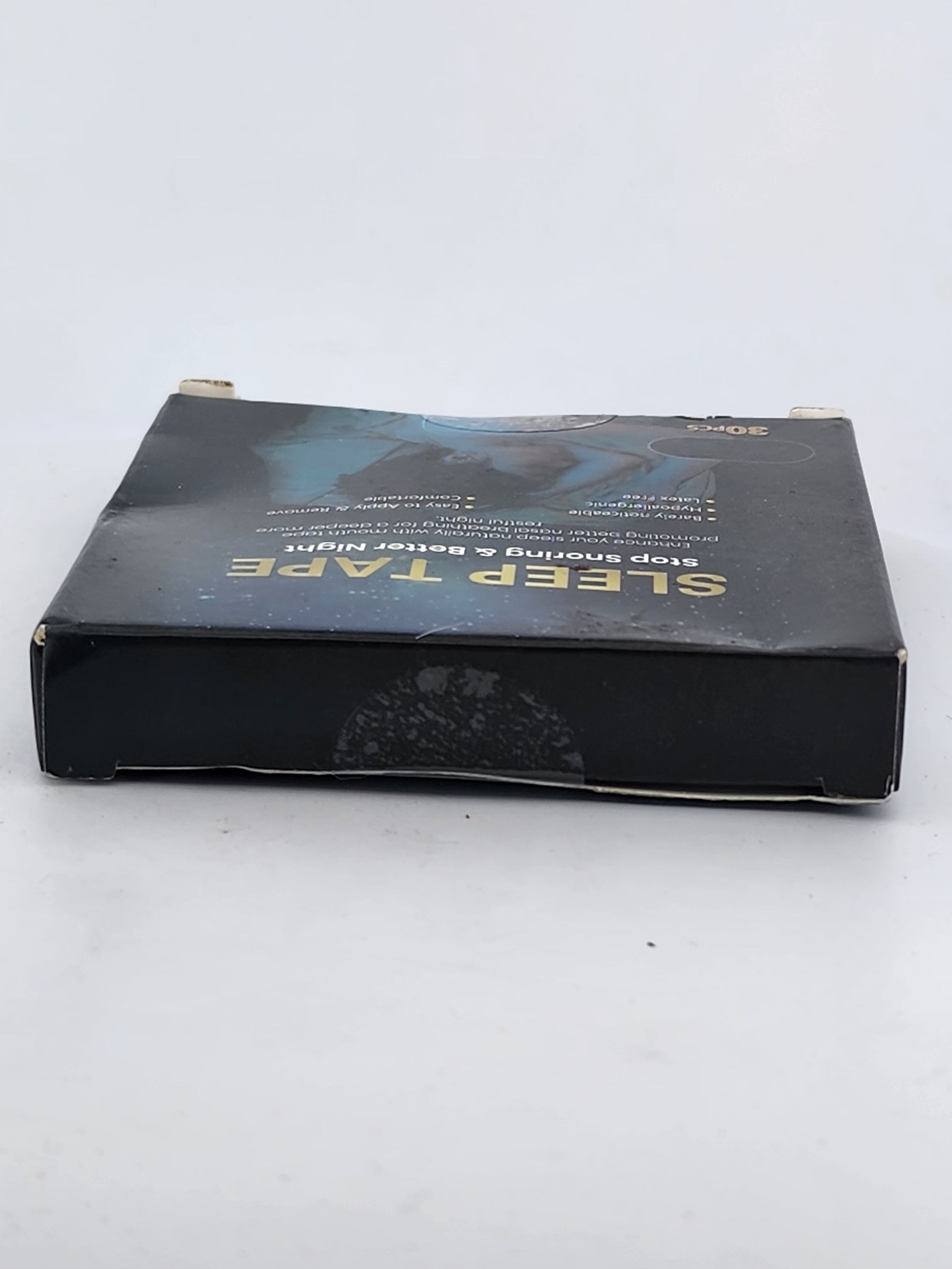 Black sleep tape packaging on a white background