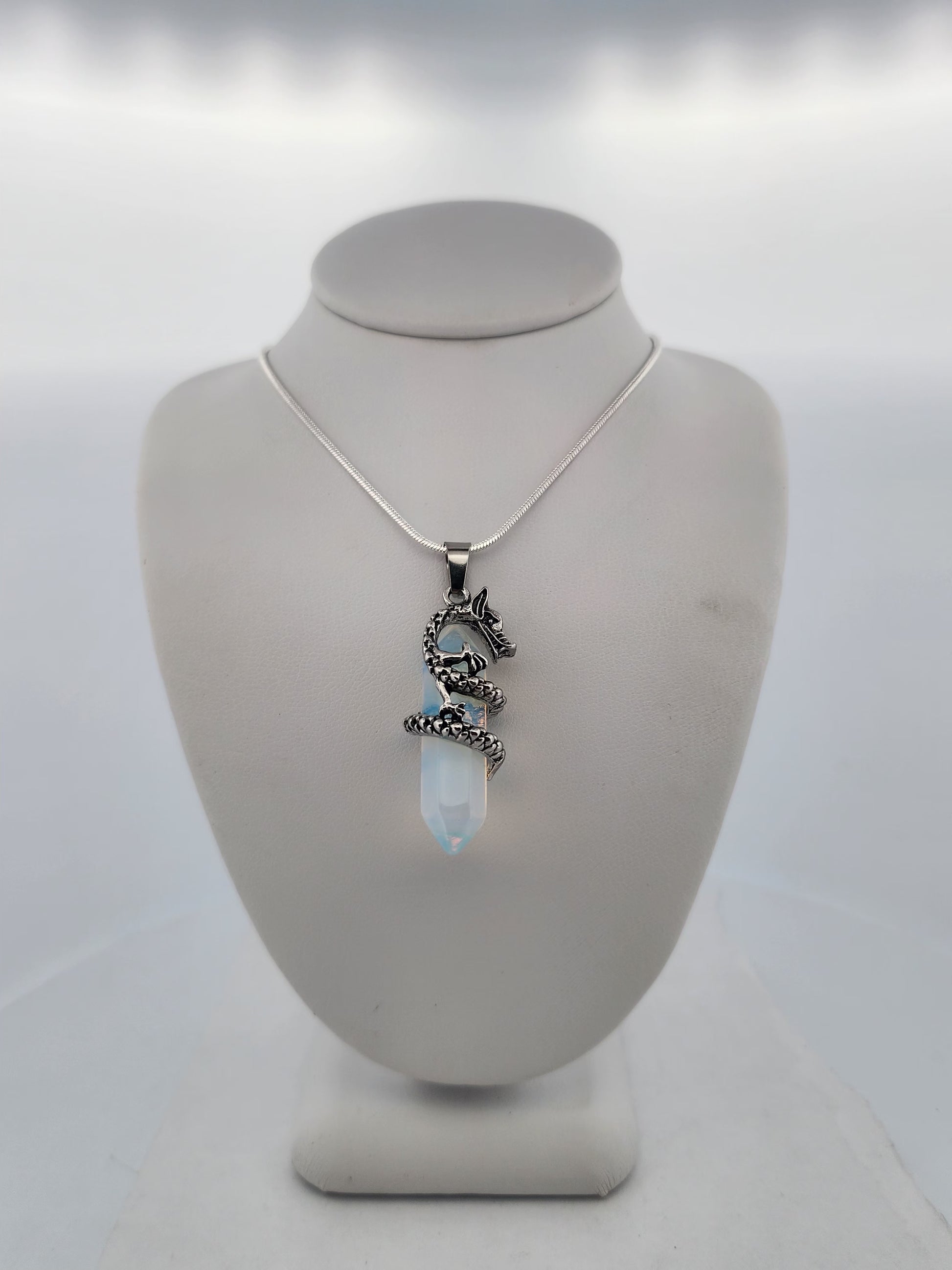 Necklace with a pendant on a mannequin bust against a white background