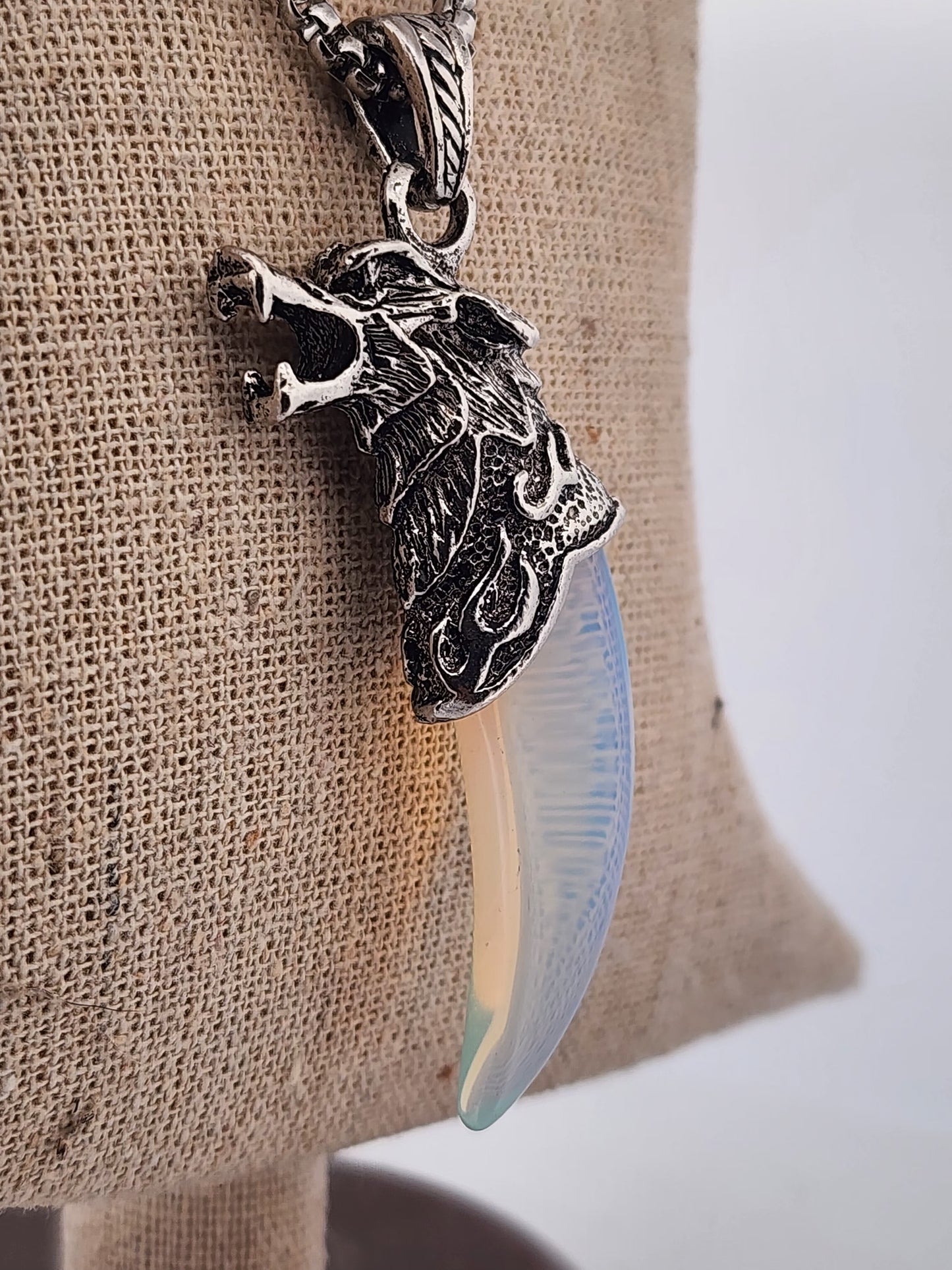 Decorative knife with ornate handle on a textured surface