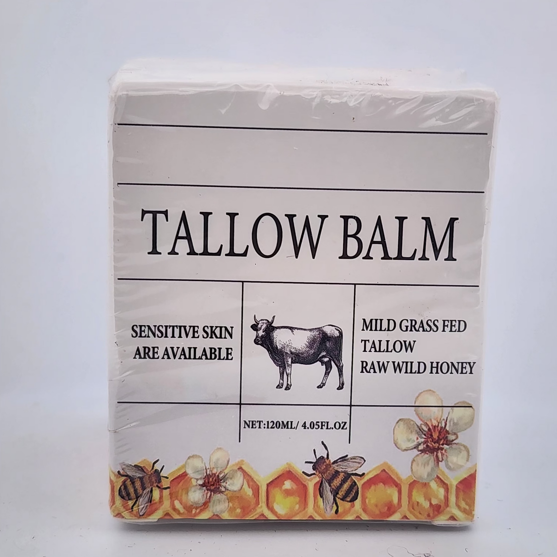 Tallow balm packaging with cow illustration and honeycomb design on a white background
