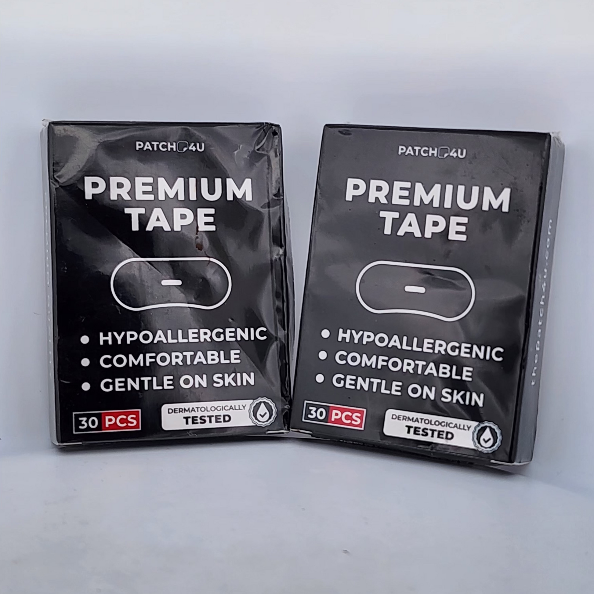 Two packages of Premium Tape by PATCH 4U on a light gray background
