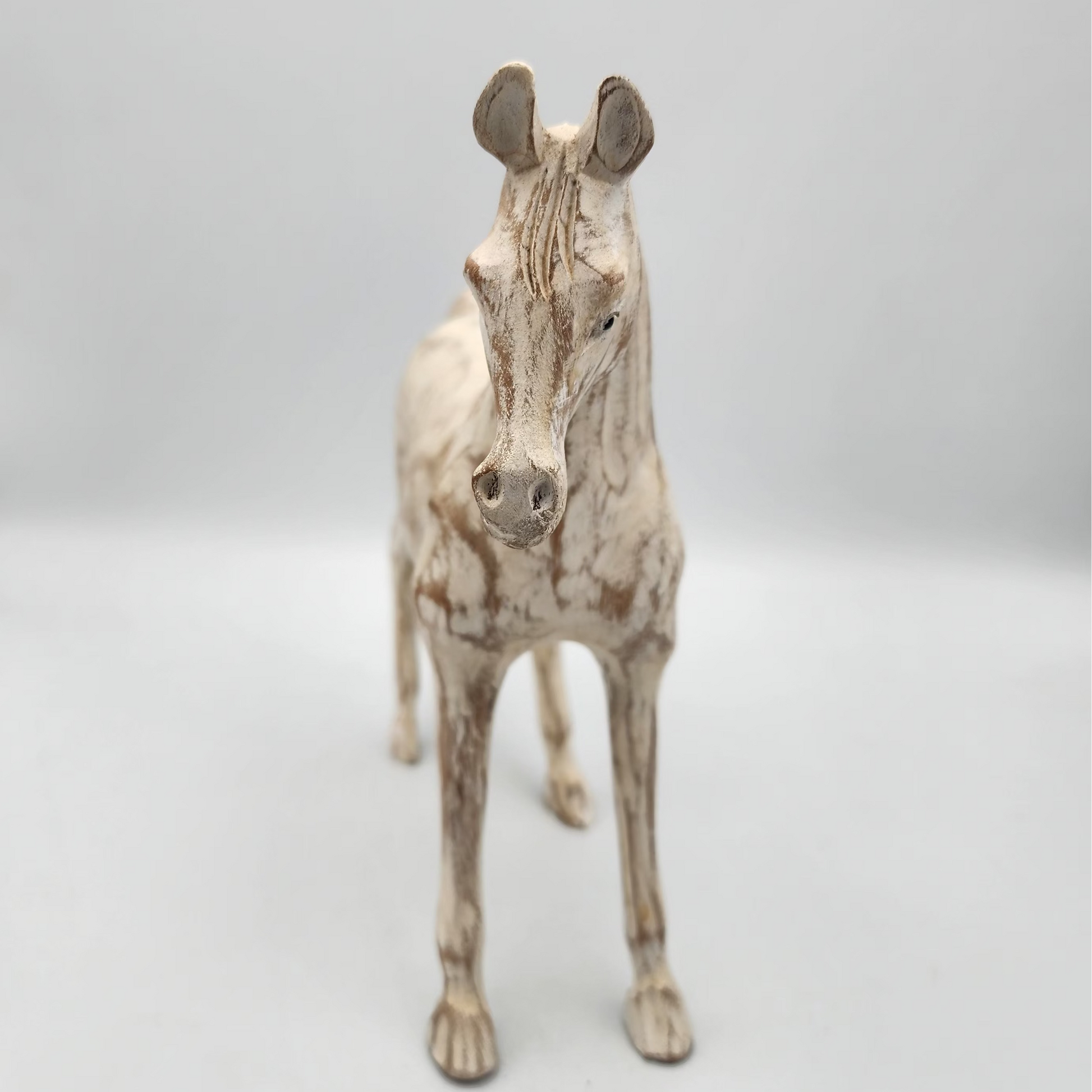 Stylized horse figure on a plain background
