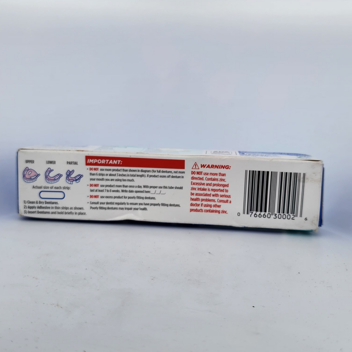 Product packaging with text and a barcode on a white background