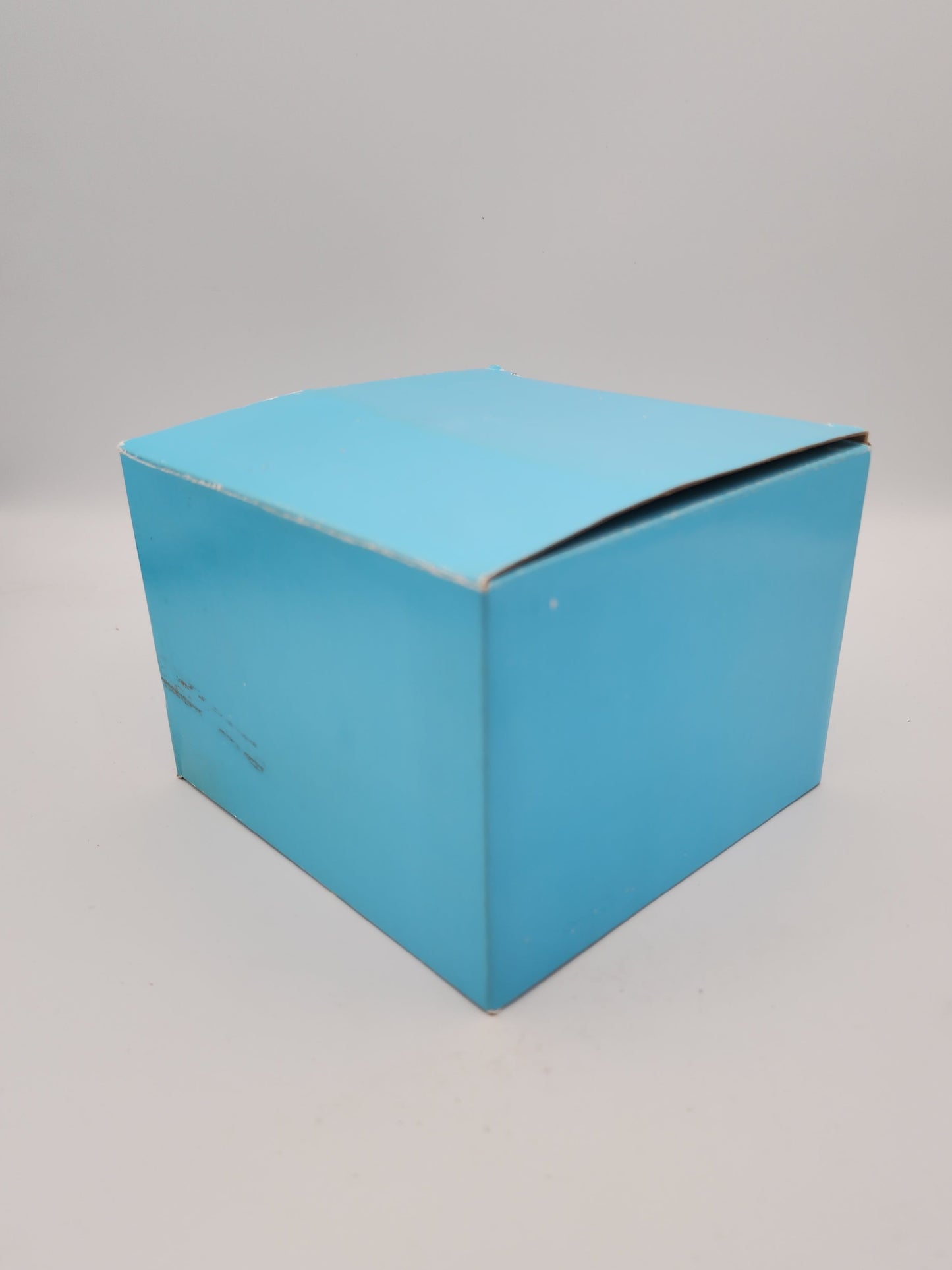 Blue cardboard box on a gray background