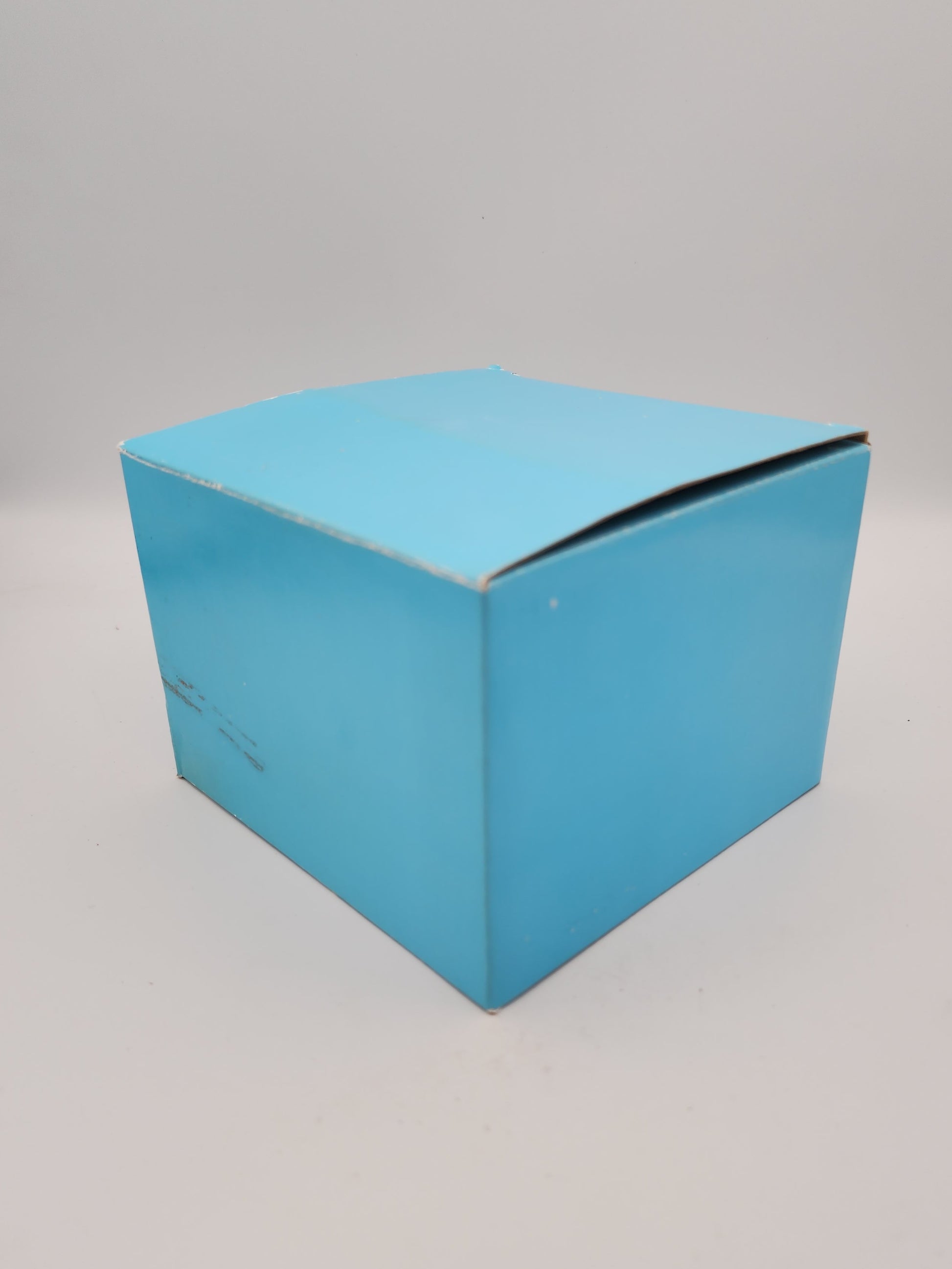 Blue cardboard box on a gray background