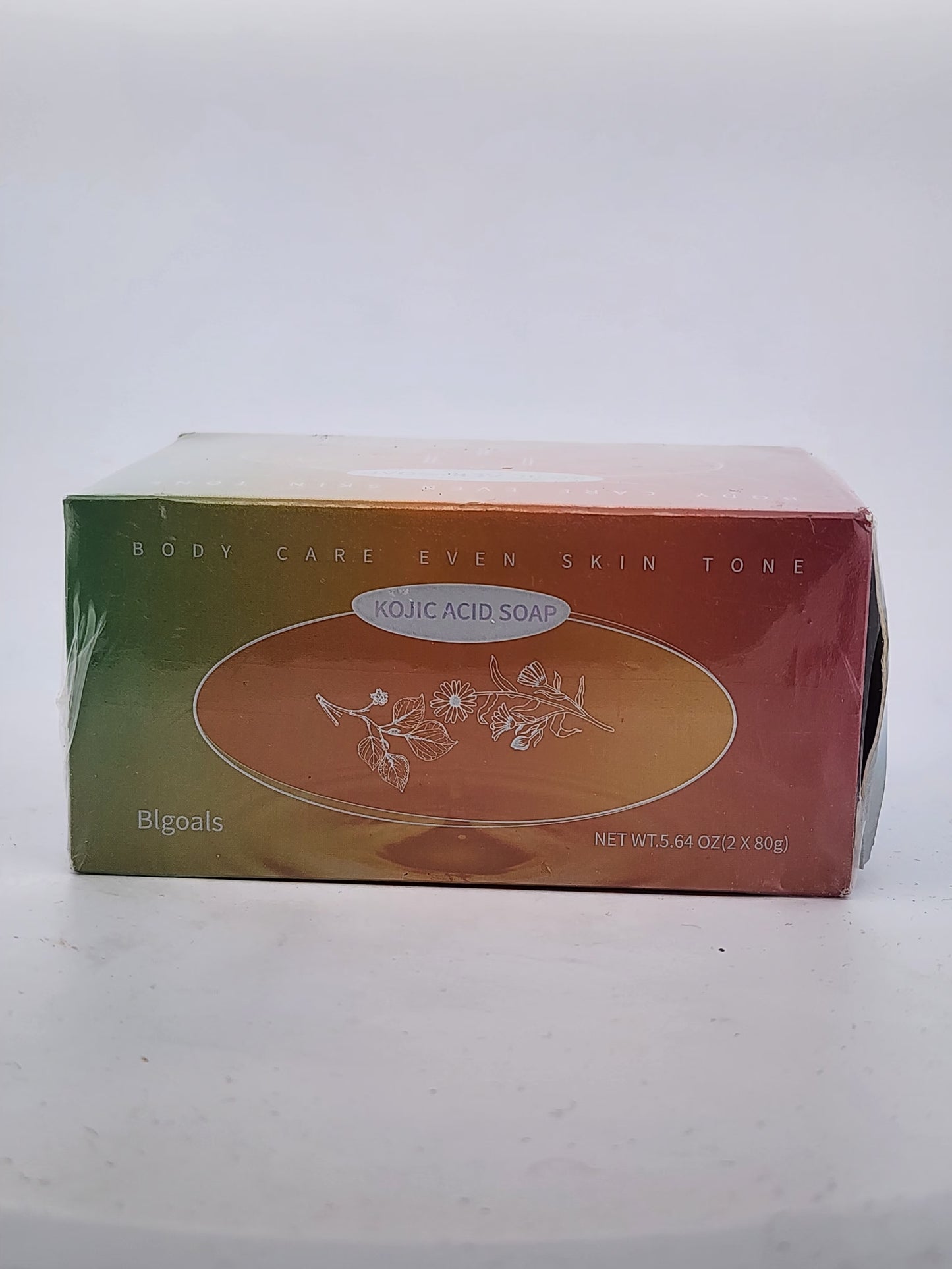 Box of Kojic Acid Soap with green and orange design on a white background