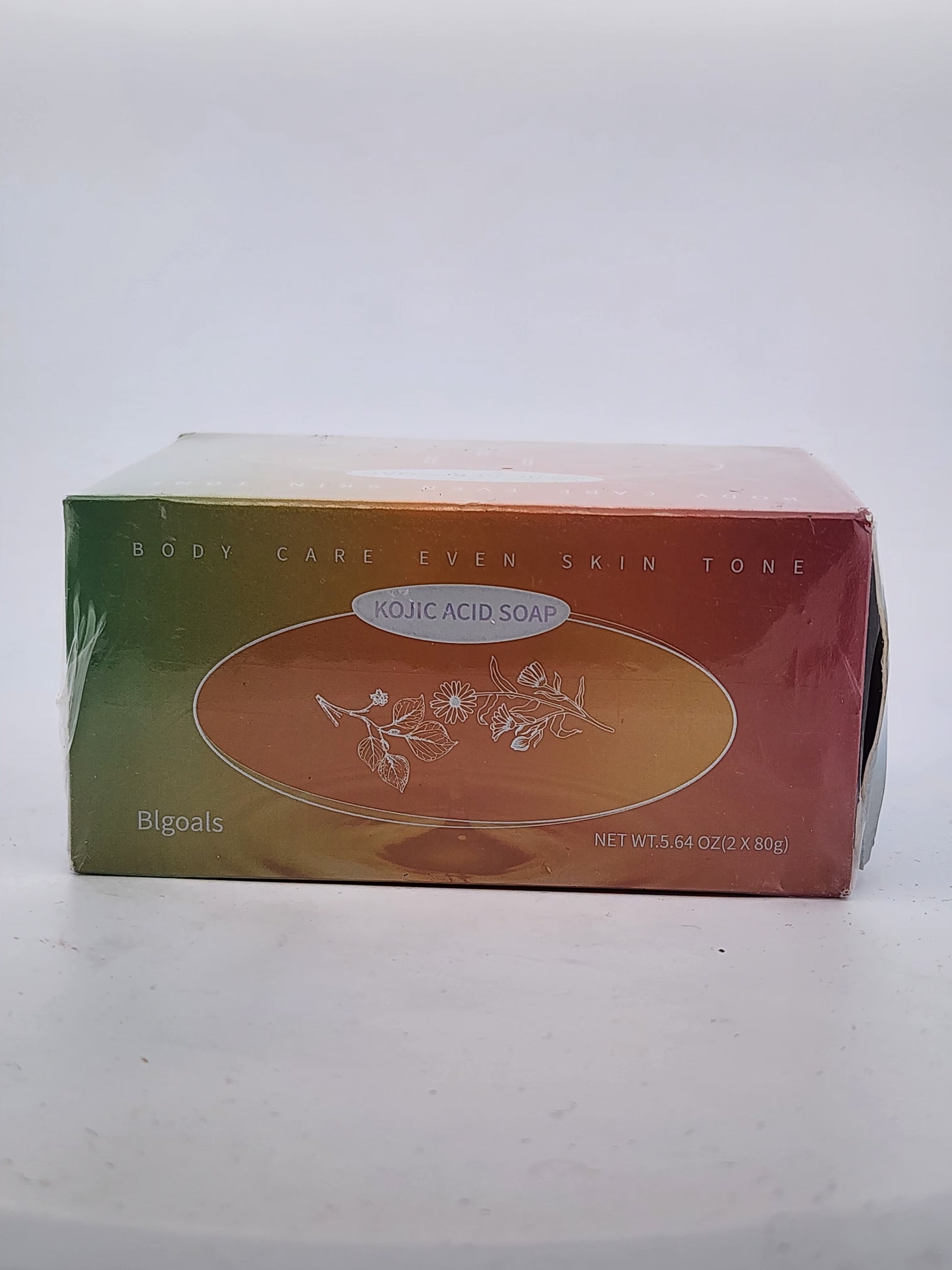 Box of Kojic Acid Soap with green and orange design on a white background