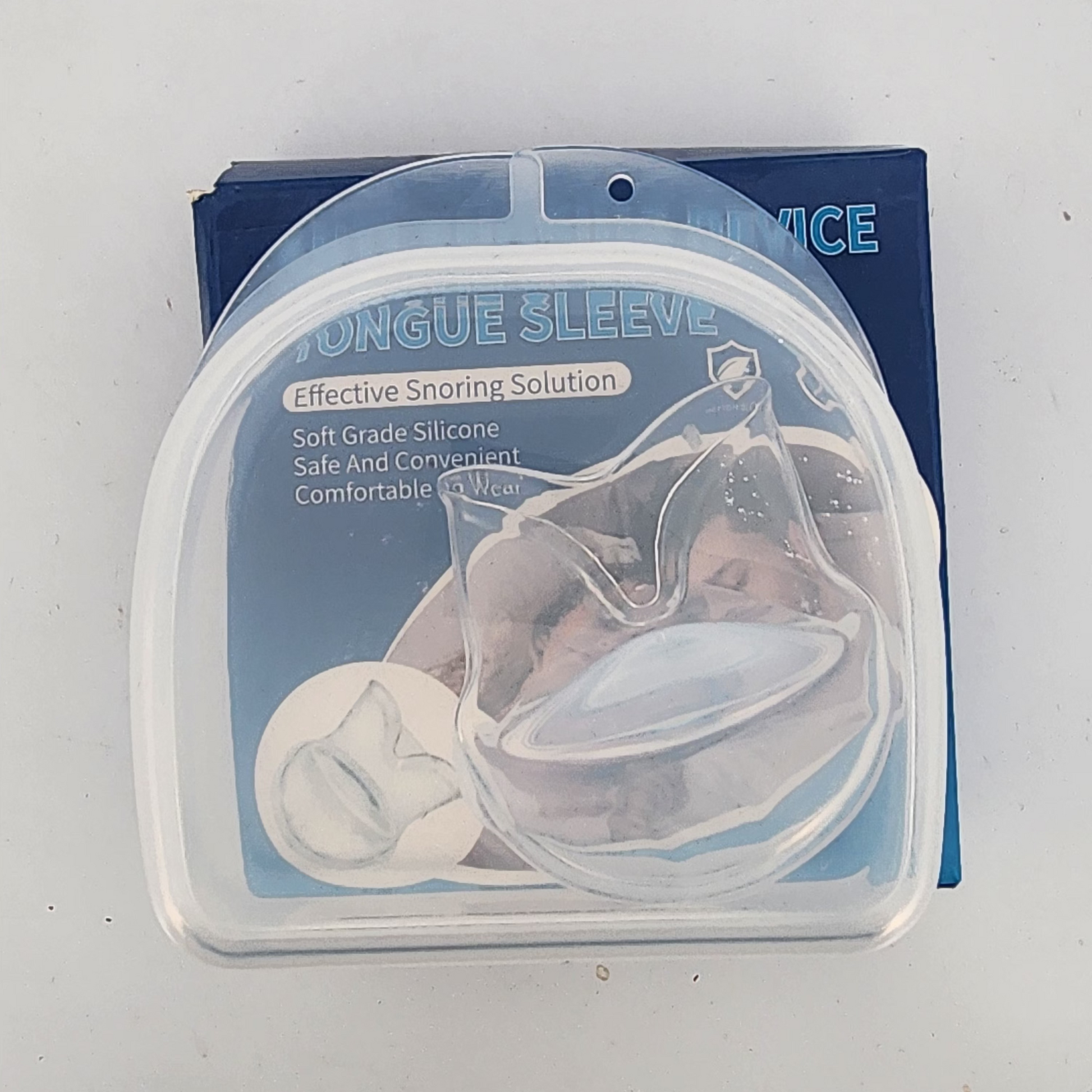 Packaged tongue sleeve with clear plastic cover on a white background