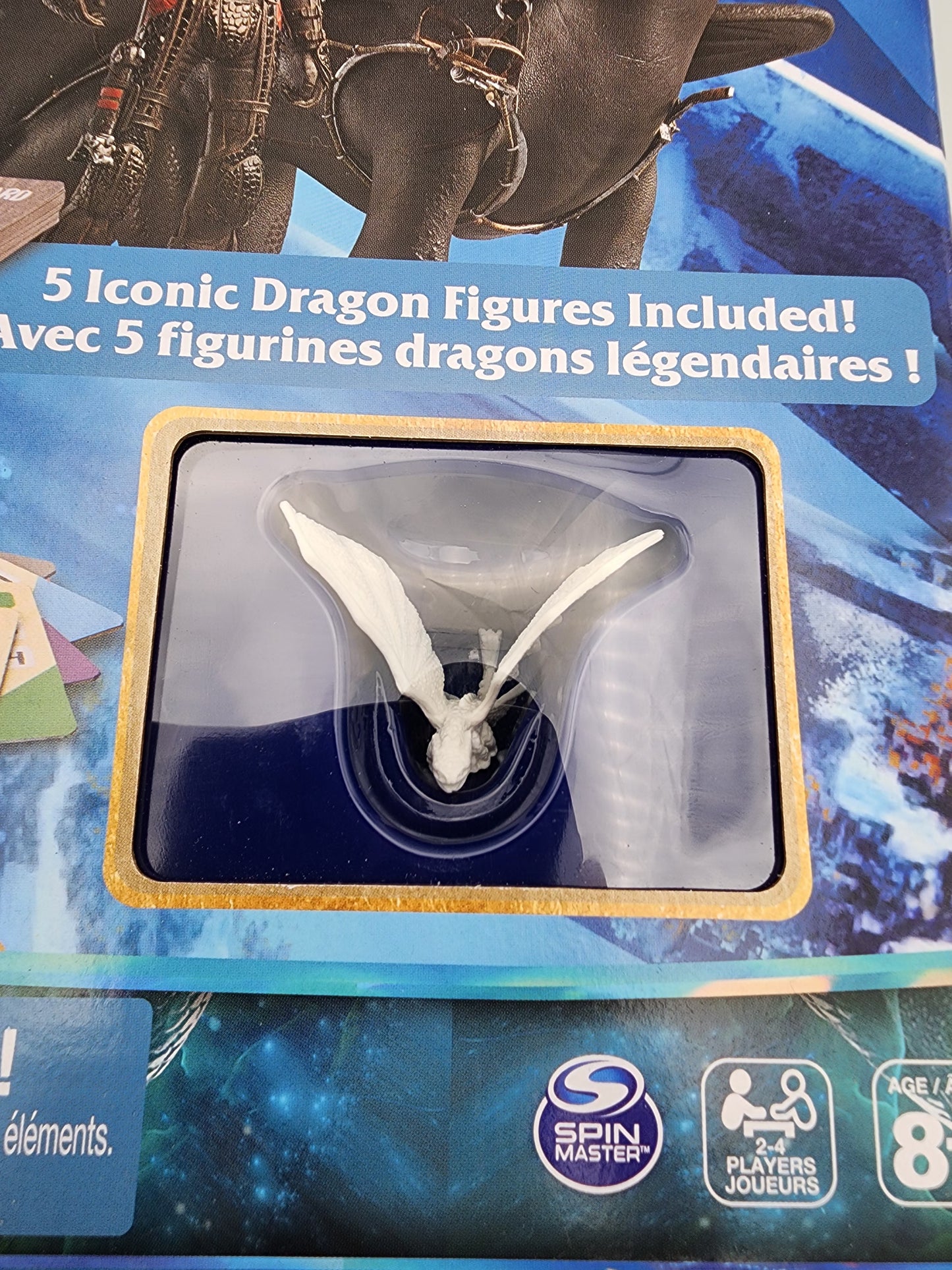 Dragon figure in packaging with Spin Master logo, indicating it's a toy product.