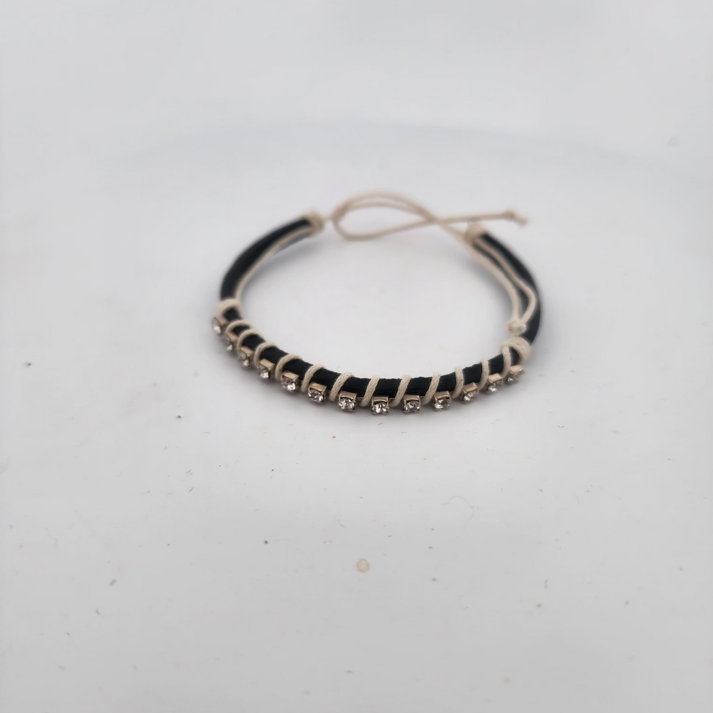 Bracelet with black and silver design on a white background