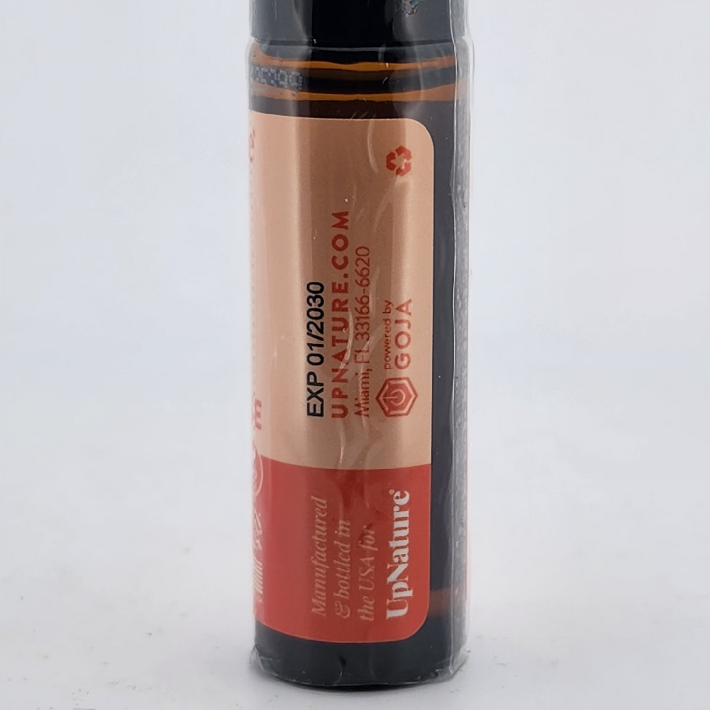 Lip balm tube with red label on a white background