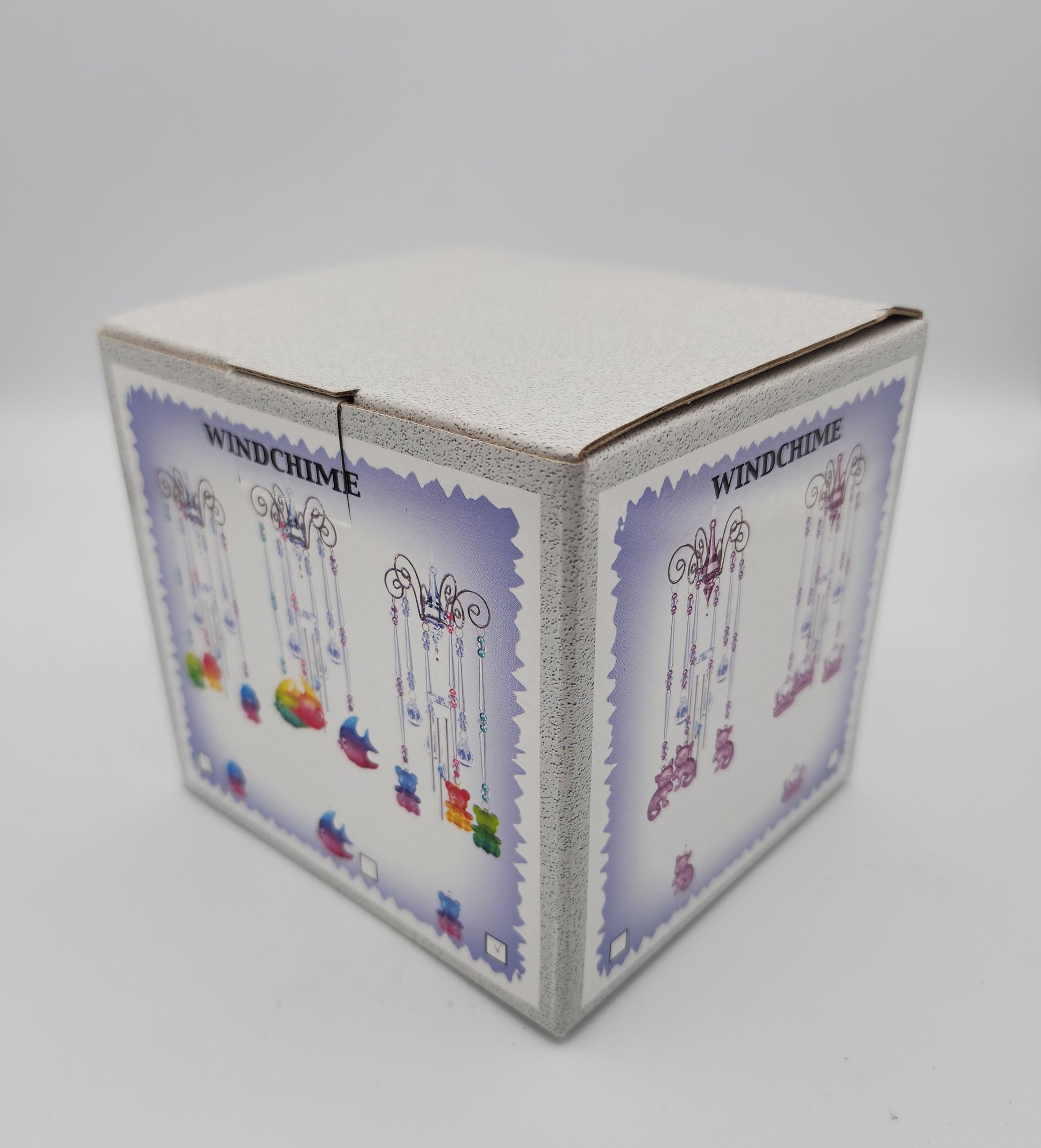 Hexagonal box with colorful designs on a white background