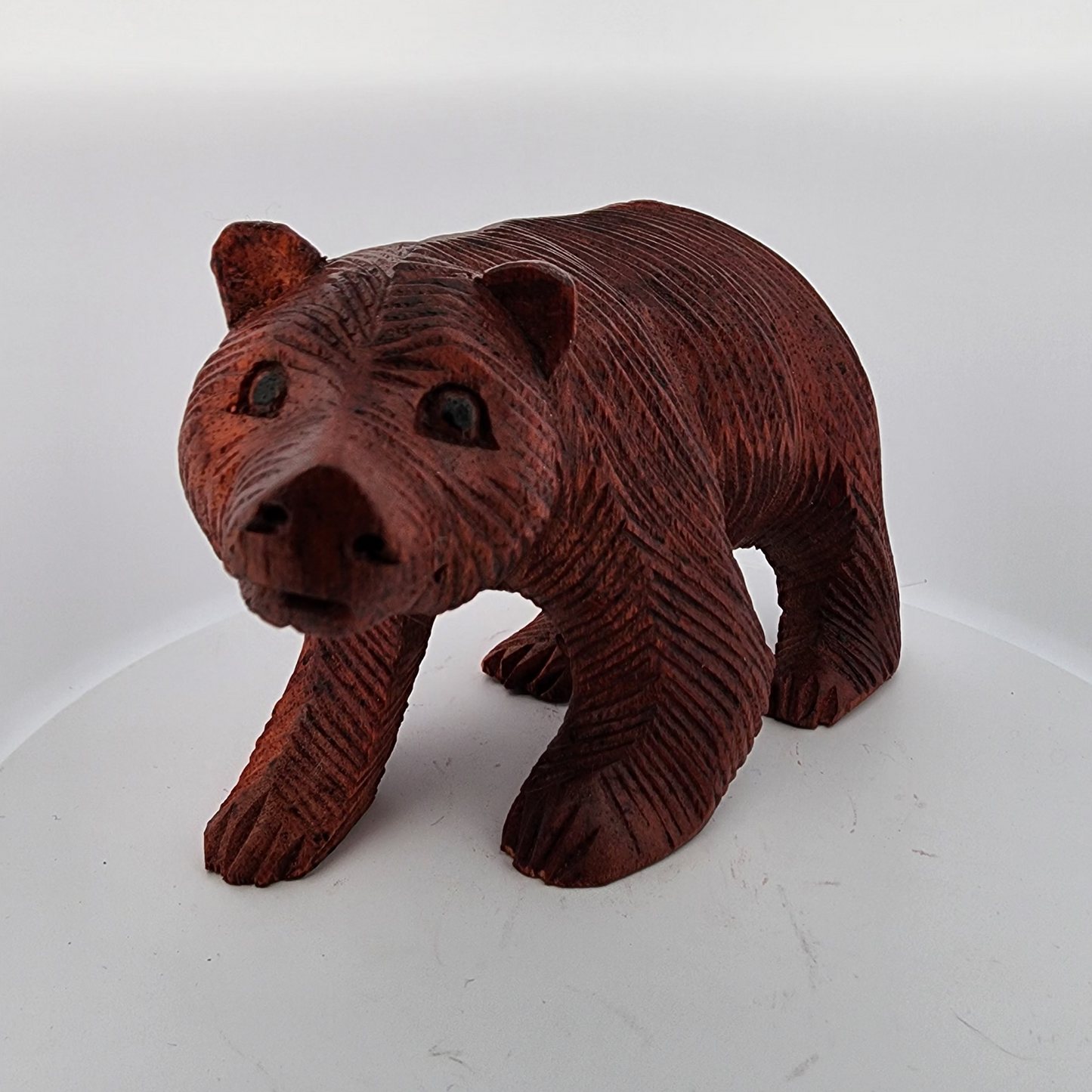 Brown bear figurine on a white background