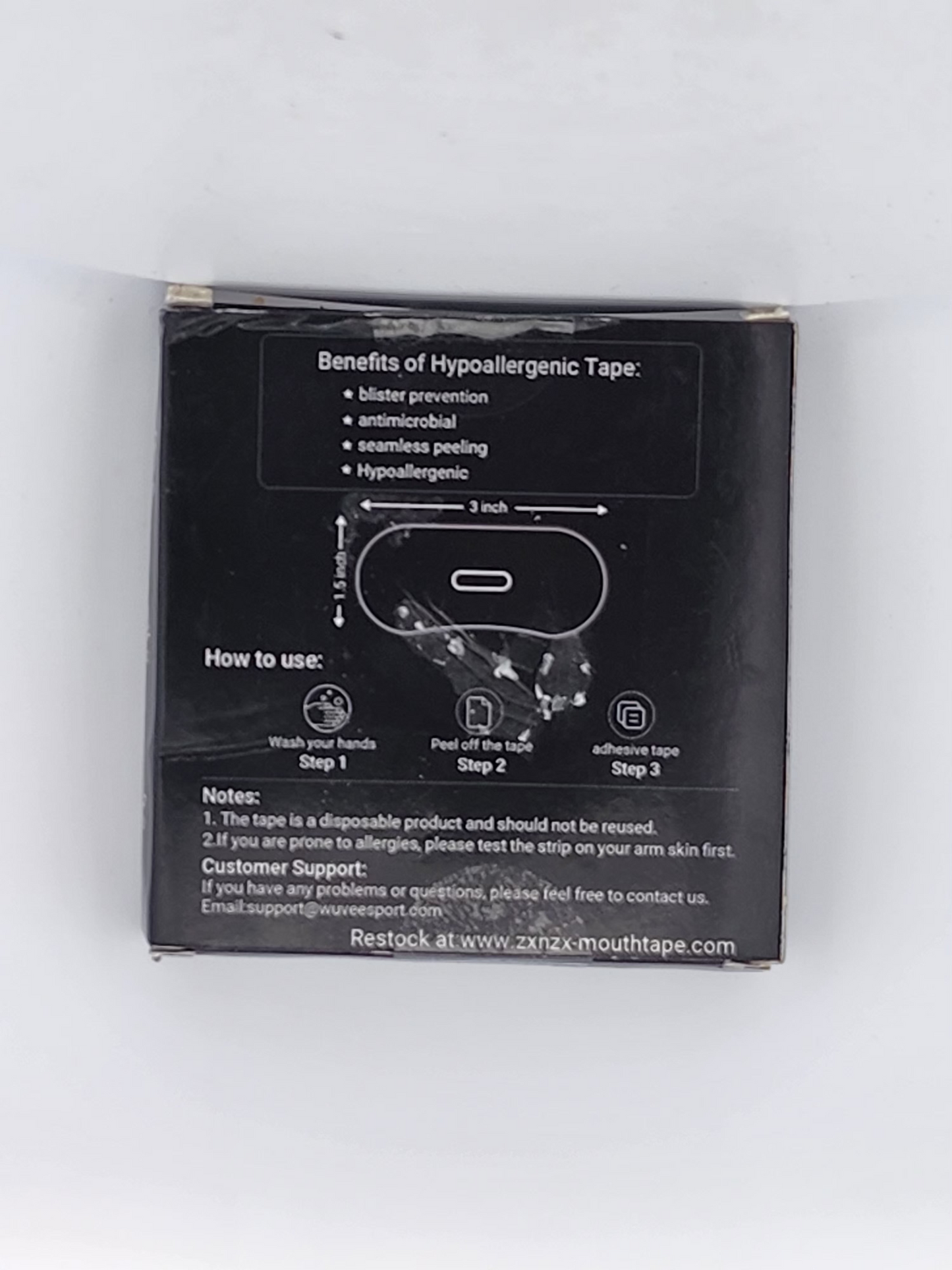 Black packaging with white text and diagrams on a white background