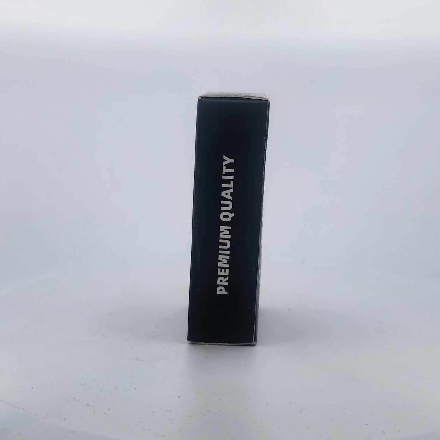 Black battery pack with 'PREMIUM QUALITY' text on a white background