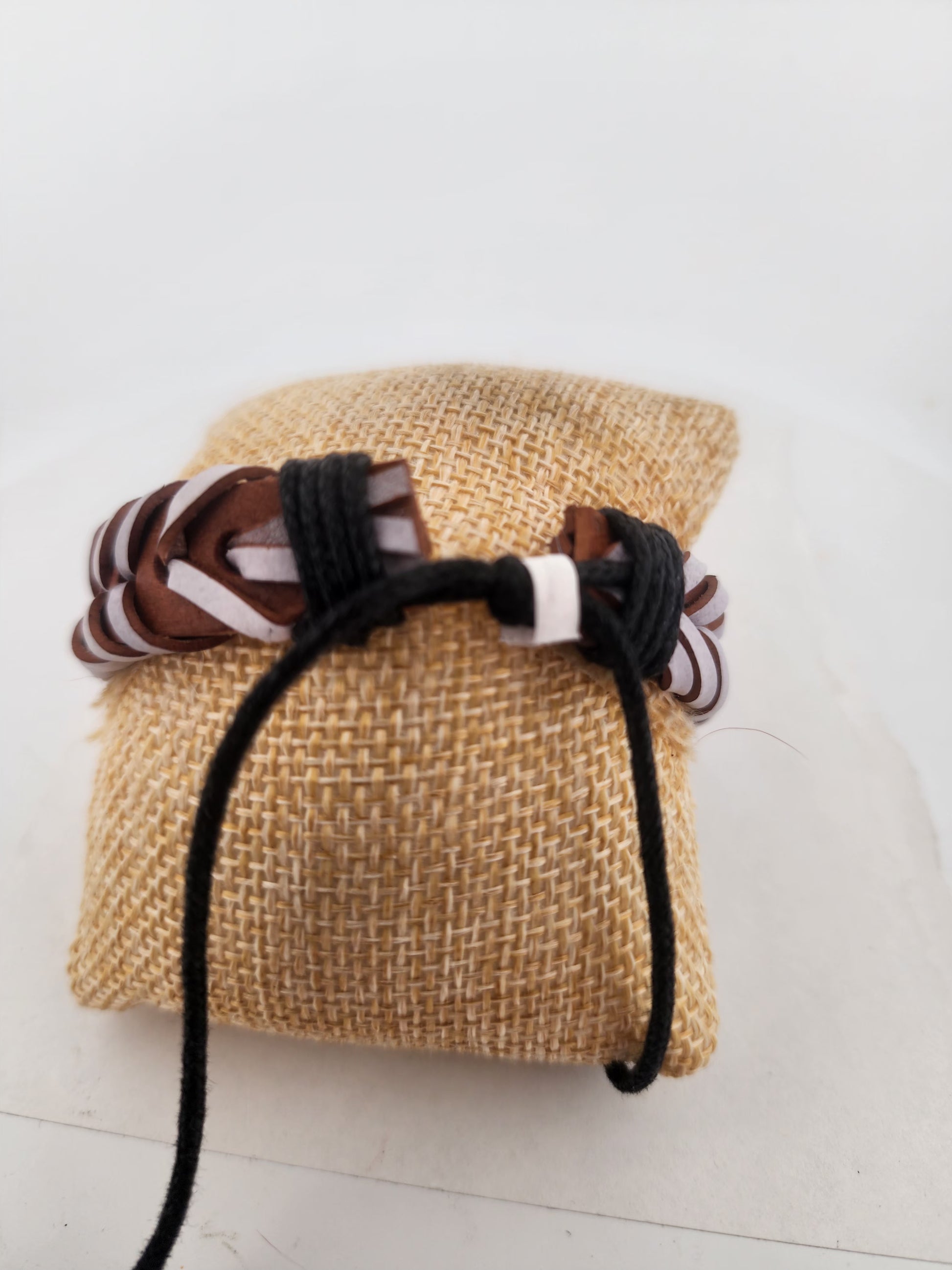 Bracelet on a woven bag with a white background