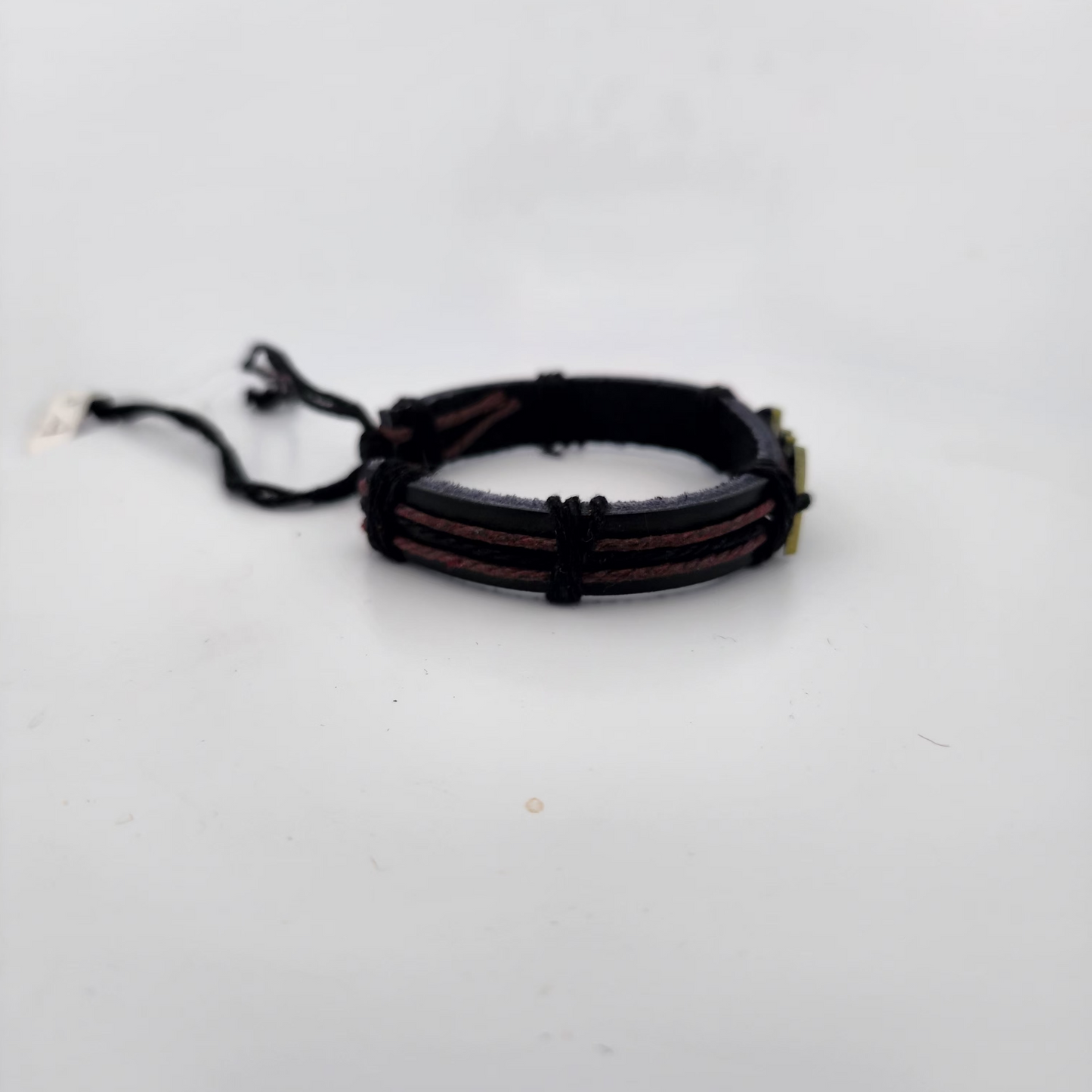 Black braided bracelet on a white background