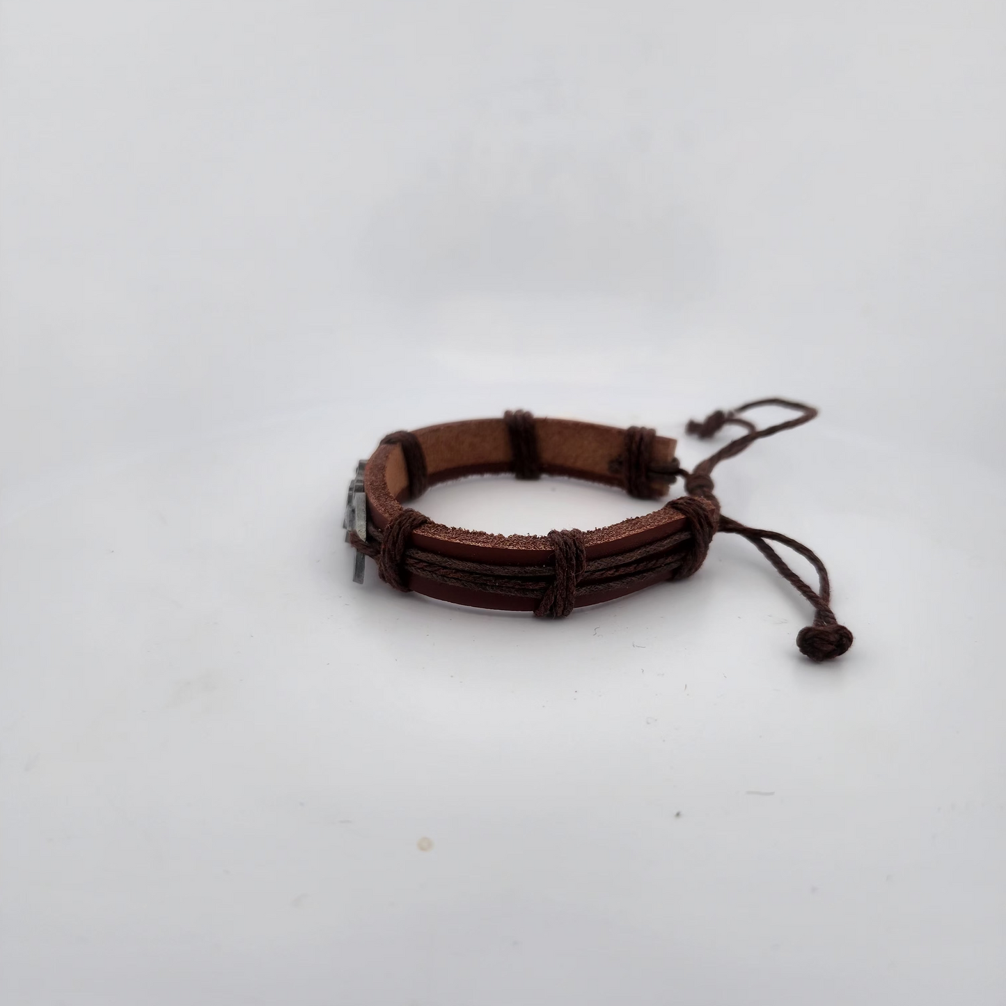 Brown leather bracelet on a white background