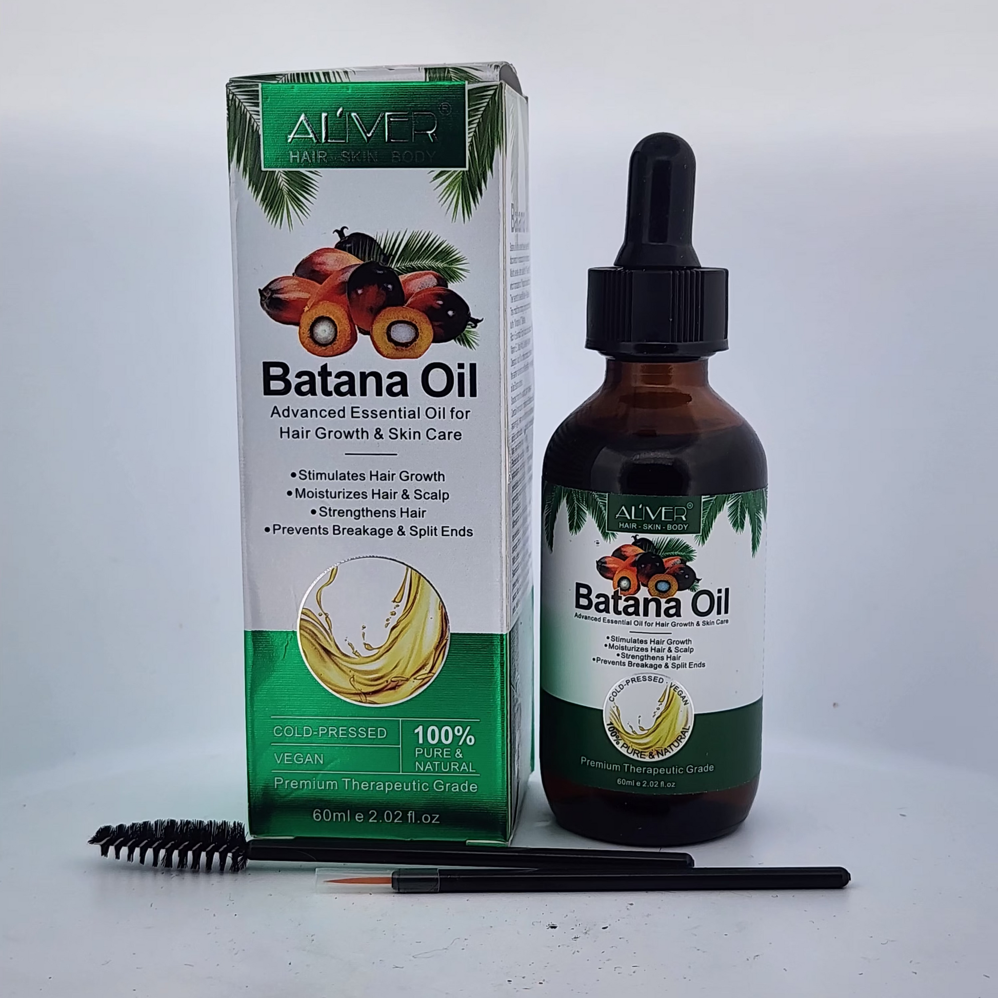 Batana Oil packaging and bottle with a brush on a white background