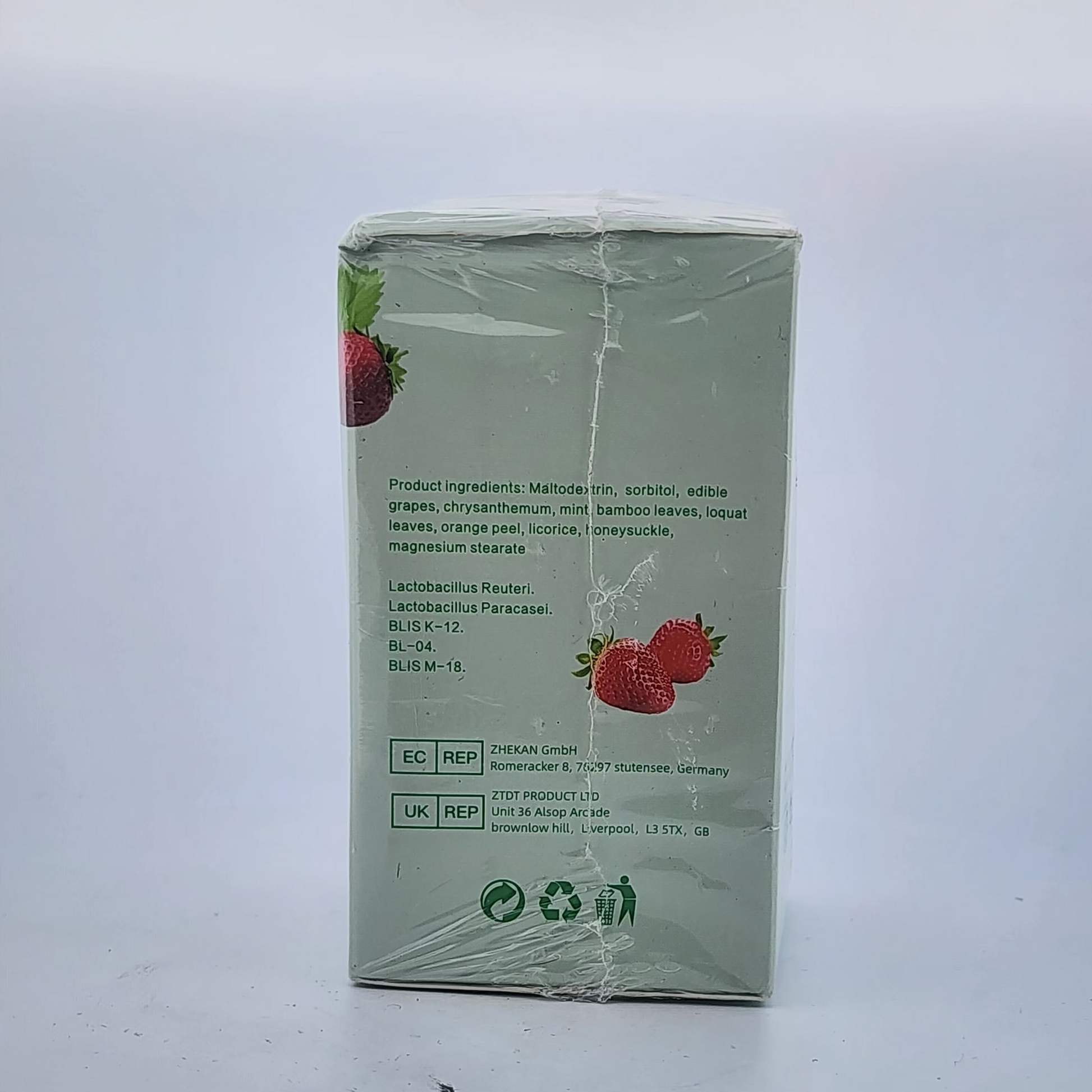 Product packaging with strawberry graphics on a white background