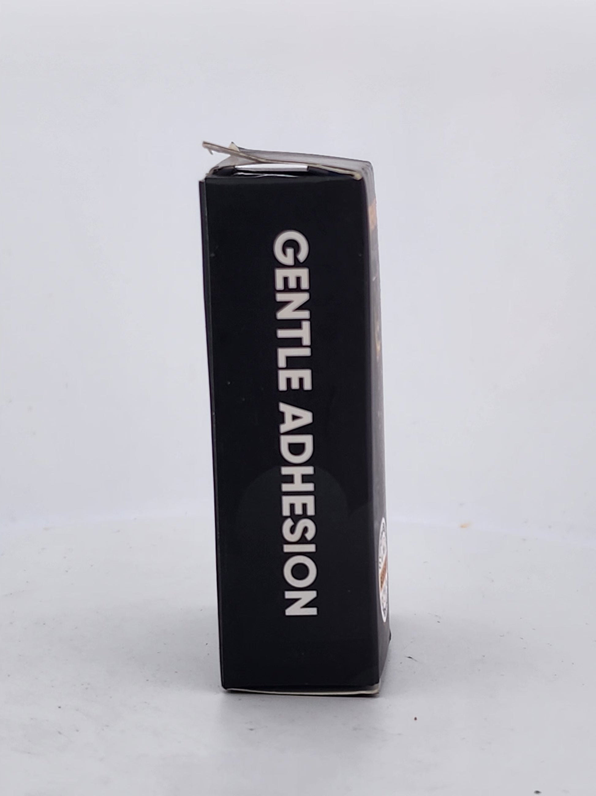 Black box with 'Gentle Adhesion' text on a white background
