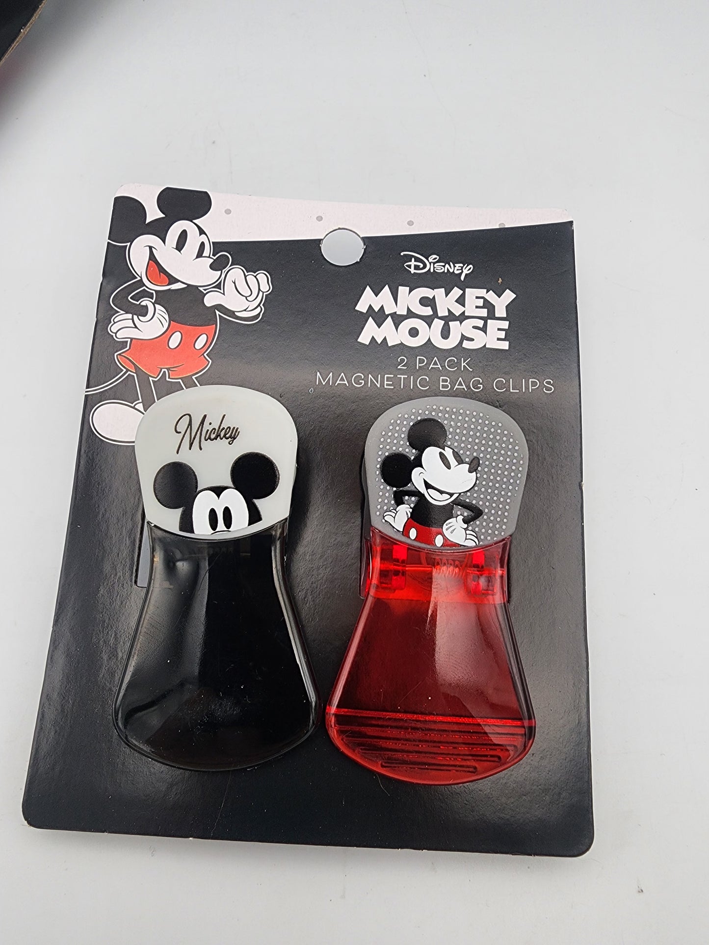 Two Mickey Mouse magnetic bag clips in packaging on a white background