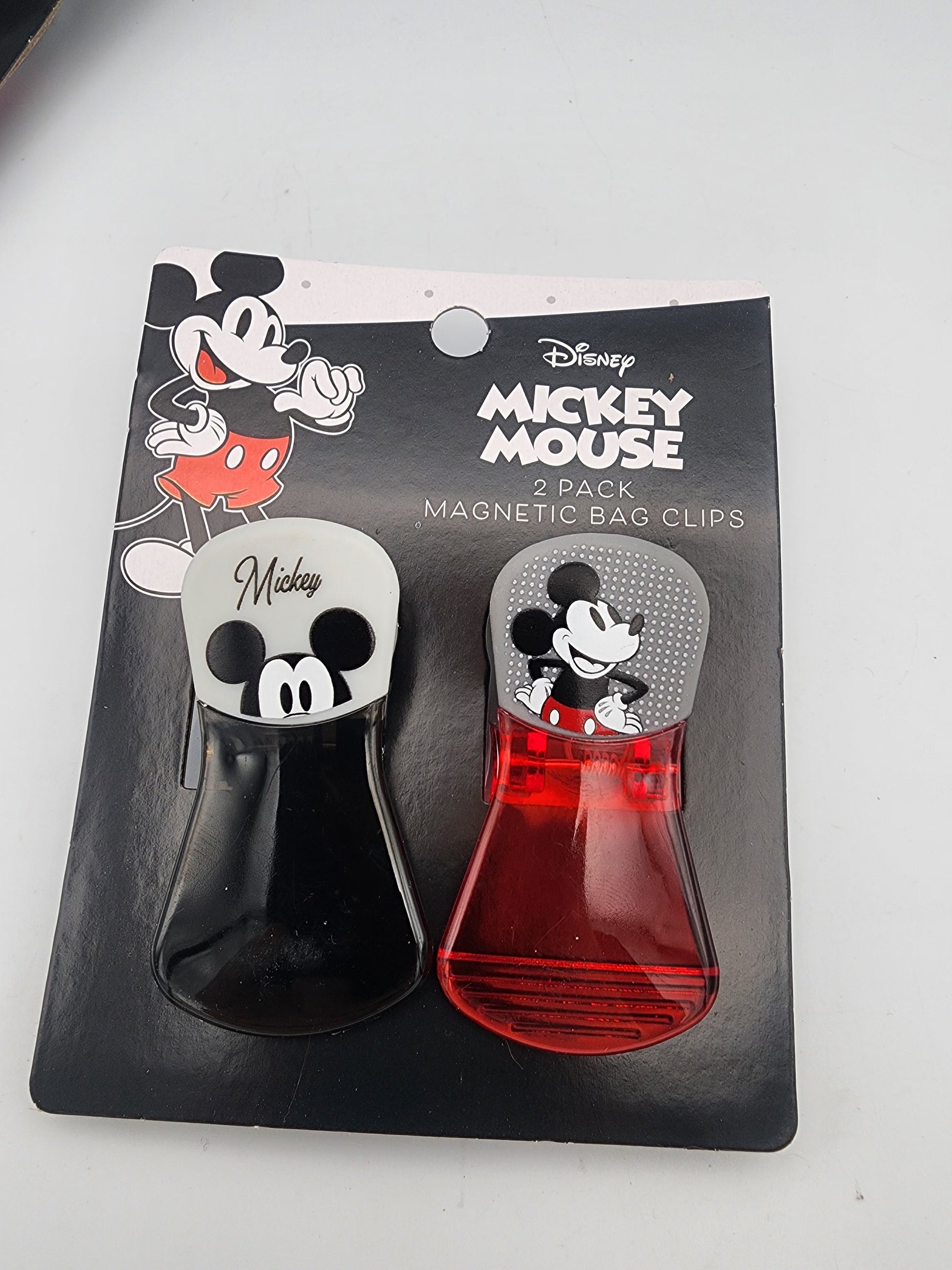 Two Mickey Mouse magnetic bag clips in packaging on a white background