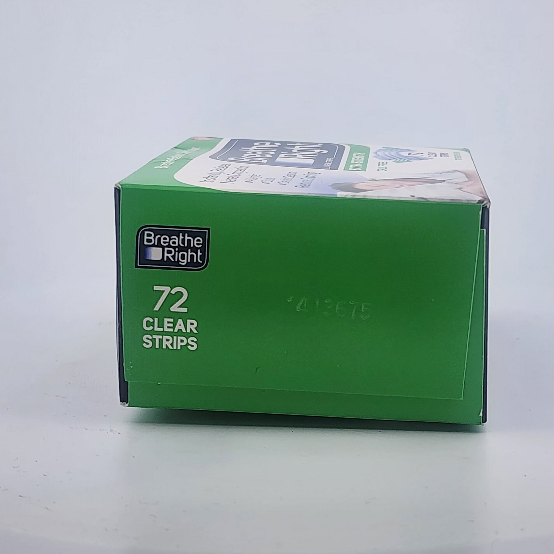 Green box of Breathe Right clear strips on a white background