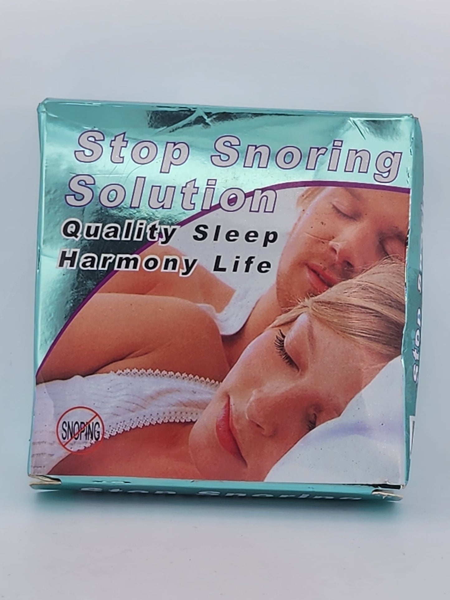 Product packaging for 'Stop Snoring Solution' with images of a couple and text on a light gray background.